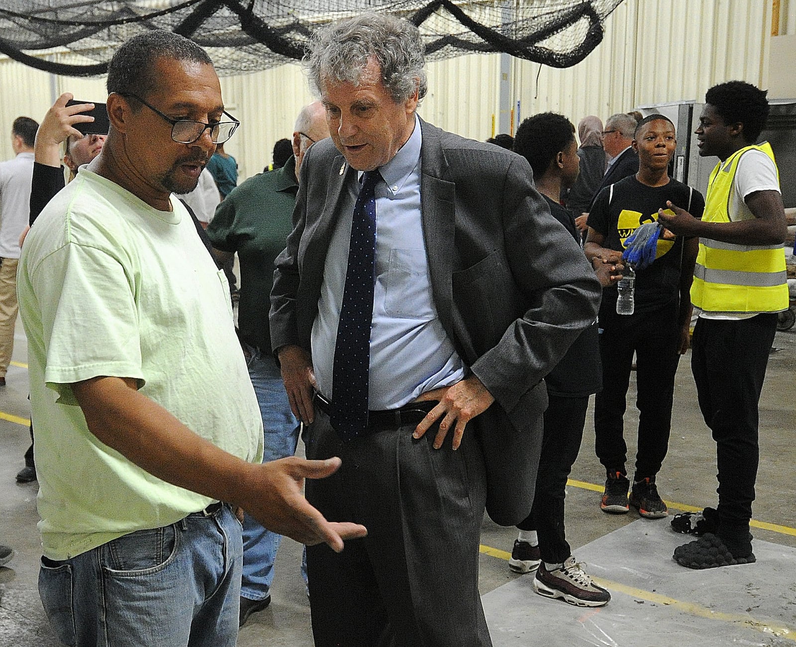 Greg West, Business Representative/Organizer for Local No. 132, Operative Plasterers and Cement Masons, left, talks with Senator Sherrod Brown, Thursday, June 29, 2023 at the Dayton Building Trades Construction Camp. The event was held at the IBEW Local 82 Hall. MARSHALL GORBY\STAFF