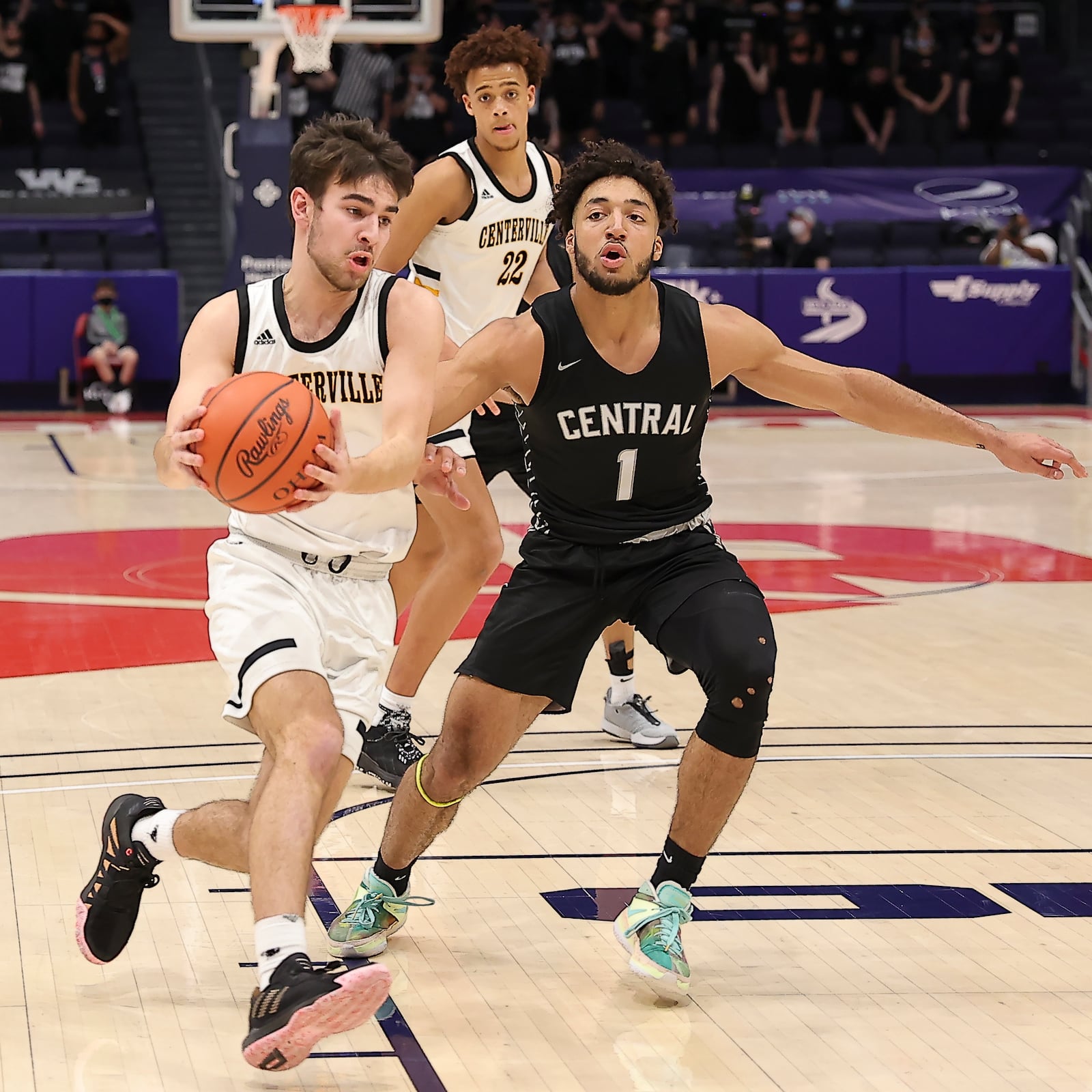 Centerville's Quinn Hafner drives past Westerville Central's Tasos Cook during Sunday's Division I title game at UD Arena. Michael Cooper/CONTRIBUTED