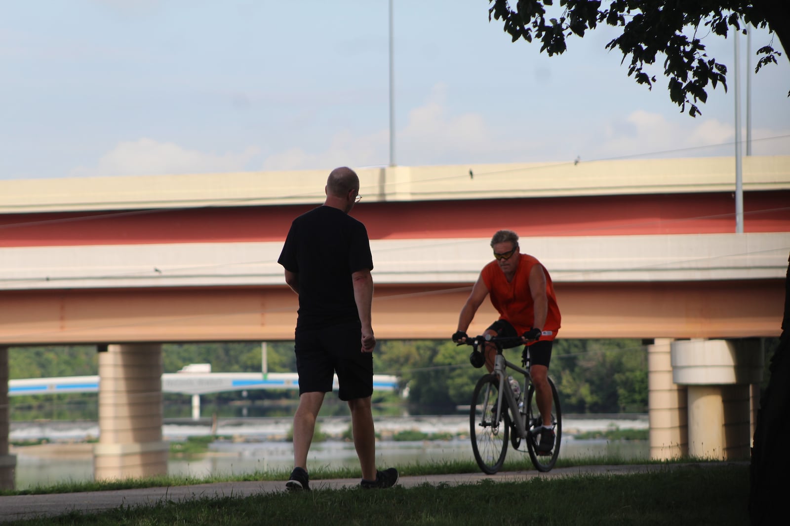 People walk and bike along the river near Deeds Point MetroPark. CORNELIUS FROLIK / STAFF