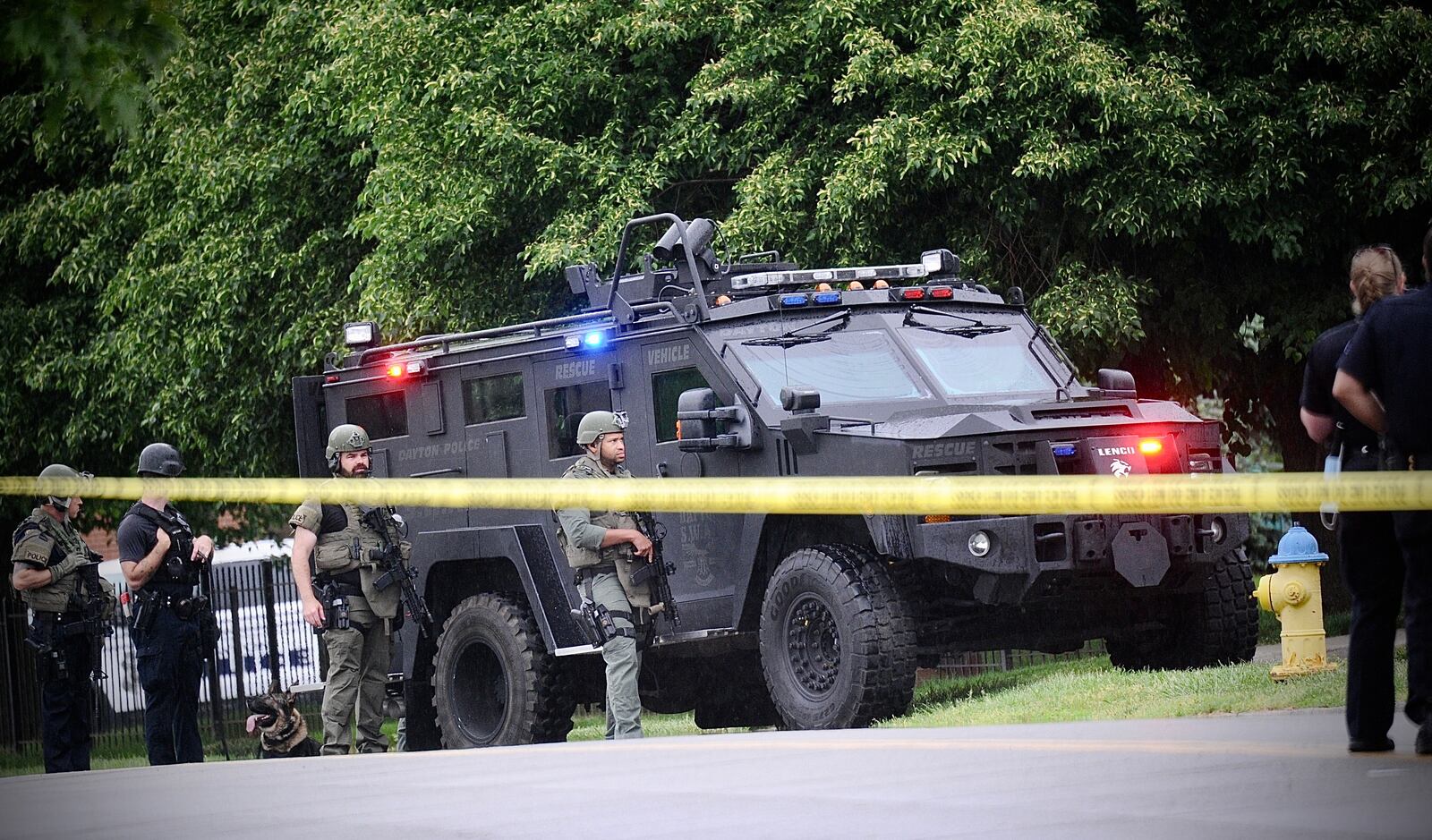 SWAT and hostage negotiation teams responded to apartments on West Stewart Street in Dayton on Wednesday, May 18, 2022, after a man was shot. MARSHALL GOBRY / STAFF