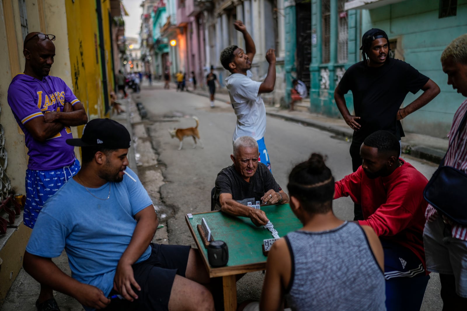 People play dominoes on the street in Havana, Cuba, Monday, Oct. 21, 2024. (AP Photo/Ramon Espinosa)