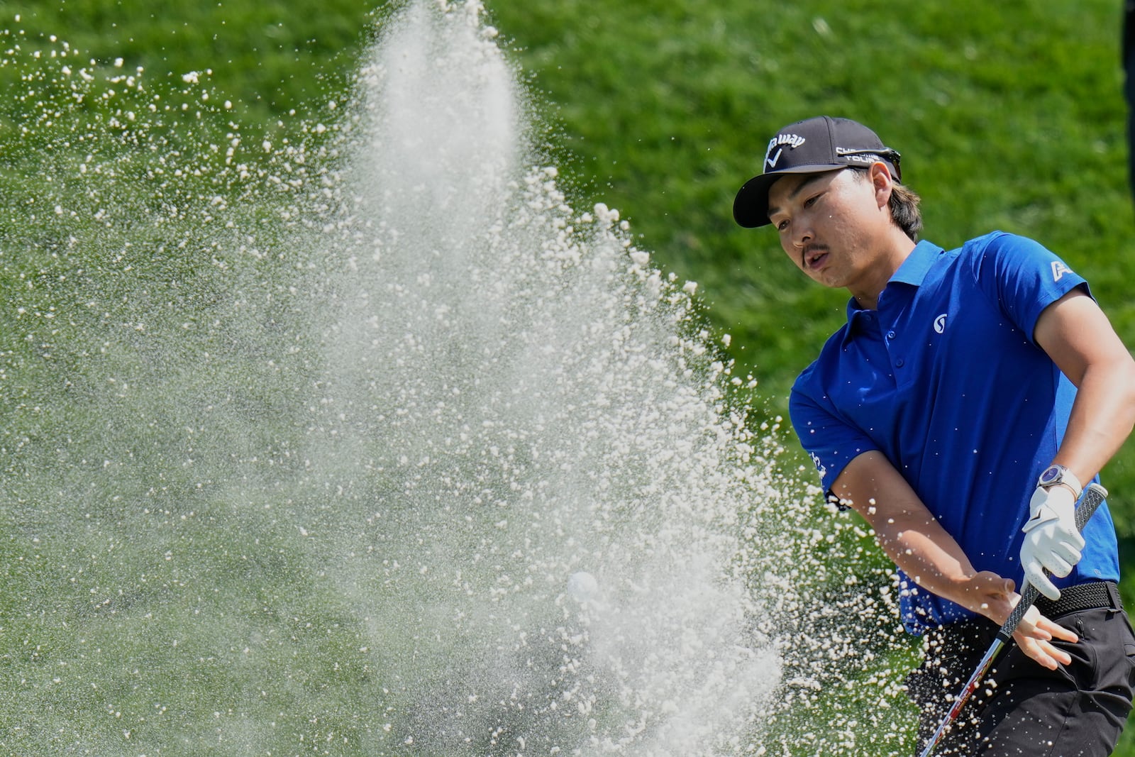 Min Woo Lee leaves his shot in the bunker on the ninth hole during the second round of The Players Championship golf tournament Friday, March 14, 2025, in Ponte Vedra Beach, Fla. (AP Photo/Chris O'Meara)