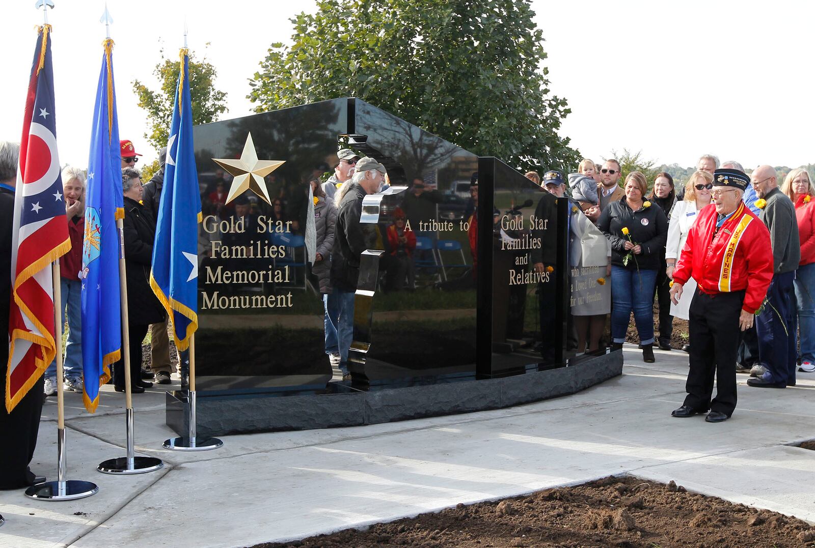 Gold Star families,  those who have lost a son or daughter in combat, were guests of honor at the National Museum of the U.S. Air Force on Tuesday where a new Gold Star Families Memorial Monument was unveiled.  This was the 50th such memorial monument of its kind to be installed in the U.S.   WW II veteran Hershel "Woody" Williams, right, dedicated the monument to local Gold Star Families.  TY GREENLEES / STAFF