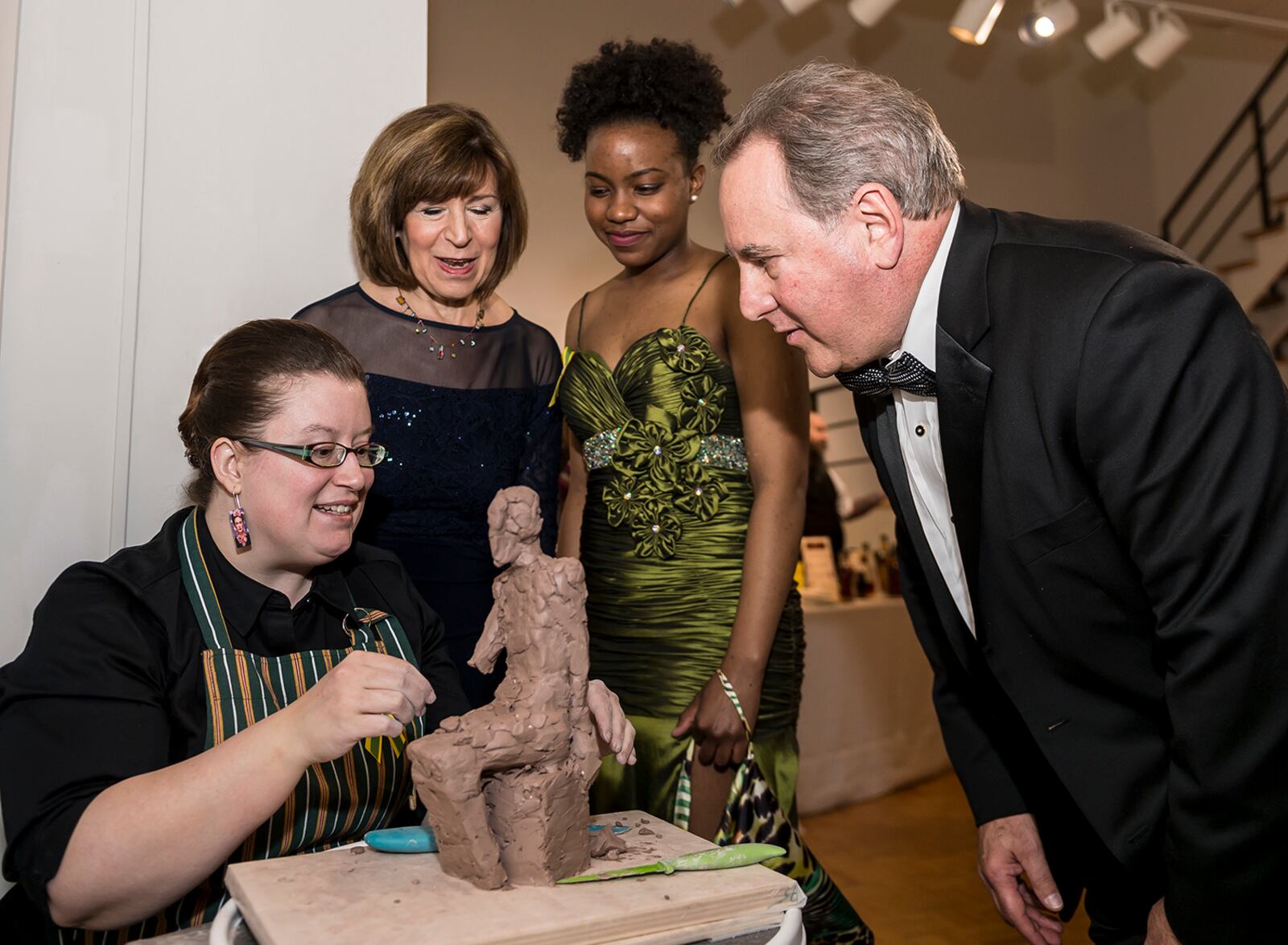 Marilyn and Larry Klaben chat with Wright State University art students Ellen Bukvic (left) and Renika Williams at the 2015 ArtsGala. Submitted photo by Will Jones.