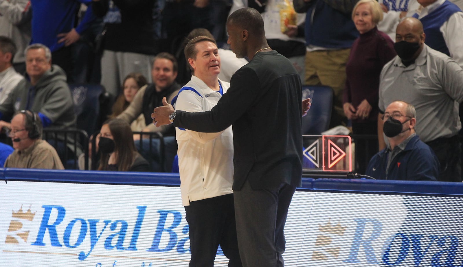 Saint Louis coach Travis Ford, left, and Dayton coach Anthony Grant greet each other after the game on Saturday, Feb. 5, 2022, at Chaifetz Arena in St. Louis, Mo. David Jablonski/Staff