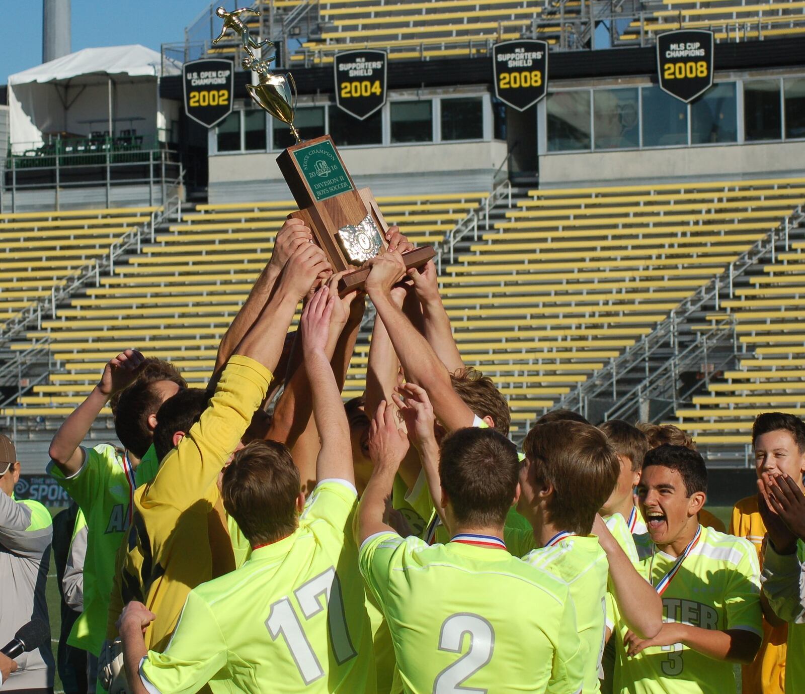 The Alter High School boys soccer team raise the trophy after winning the Division II state championship on Sunday, Nov. 13, 2016. John Cummings / Contributing photographer