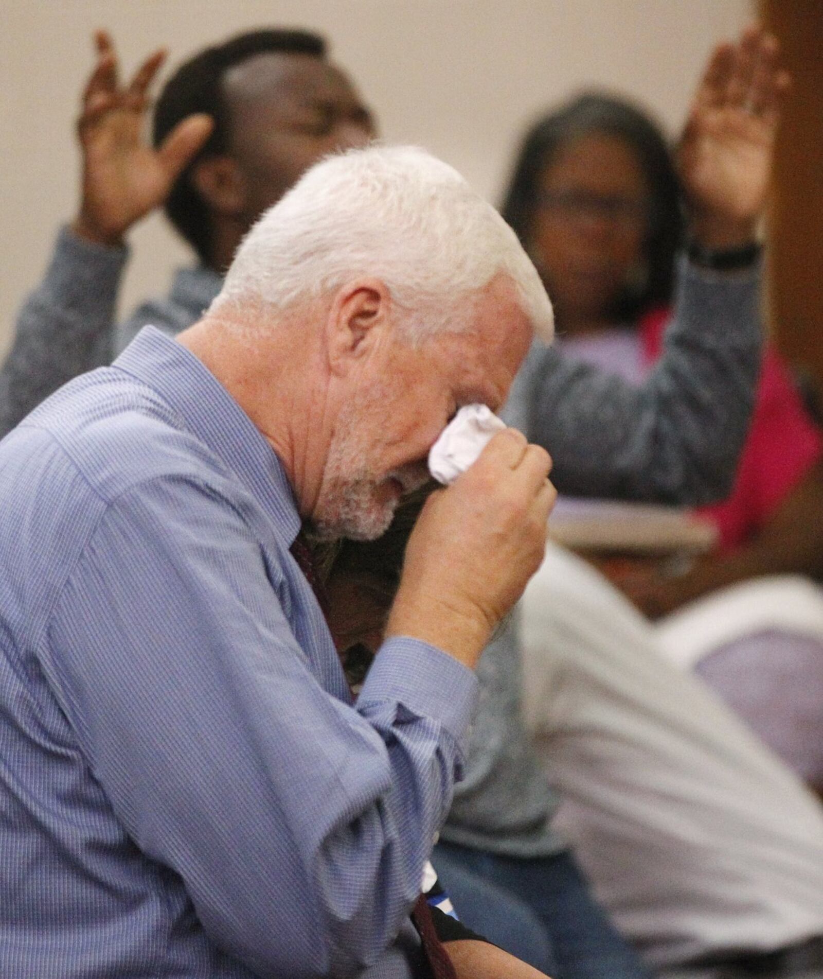 Michael Turner, father of shooting victim Logan Turner, weeps during a prayer vigil hosted by The Tabernacle Baptist Church in Dayton last month. TY GREENLEES / STAFF