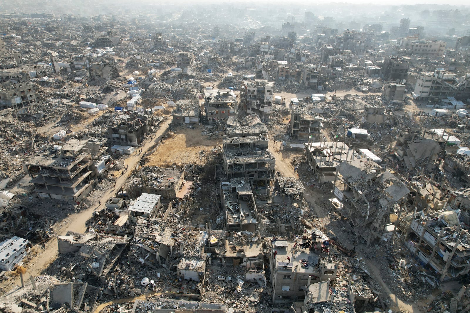 An aerial photograph taken by a drone shows the destruction caused by the Israeli air and ground offensive in Beit Lahiya, northern Gaza Strip, on Monday, Feb. 17, 2025. (AP Photo/Mohammad Abu Samra)