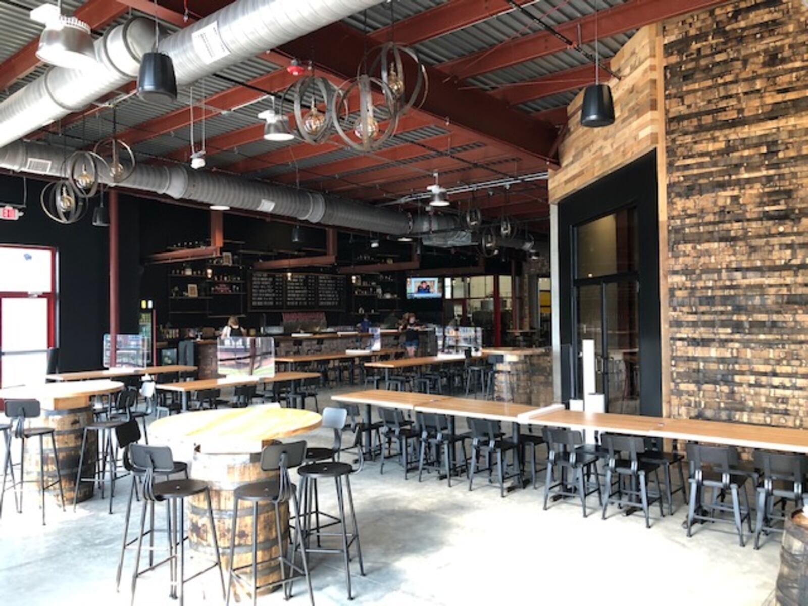 Dayton-based Warped Wing Brewing Co. will open its ambitious new second location, The Warped Wing Barrel Room & Smokery, to the public on Saturday, Aug. 29, in Springboro. MARK FISHER/STAFF


The 20,000-square-foot facility at the crossroads of Springboro at State Routes 73 and 741 will house a tap room, a restaurant, an outdoor biergarten-style patio, a large space for barrel-aging beers, a test-pilot brewery, a distribution hub and event space