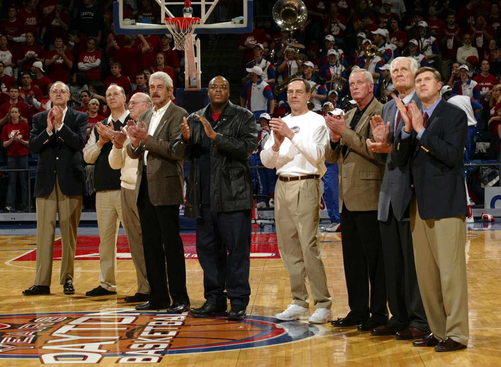 Members of Dayton's All-Century team are honored at UD Arena in 2004. From left to right are: Don "Monk" Meineke, Mike Sylvester, Arlen "Bucky" Buckhorn", Bill Chmielewski, Anthony Corbitt, Don May, Garry Roggenburk, Bill Uhl and Ed Young.