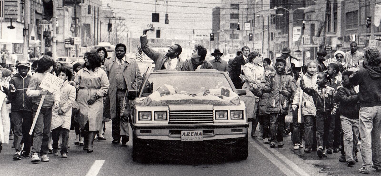 A parade for the two-time Olympic champion was held in downtown Dayton in 1984.Moses and his wife Myrella rode from Courthouse Square to Memorial Hall in a convertible with a patriotic banner covering the hood.More than 1,000 Dayton public school children walked alongside holding American flags high as Moses and his wife waved to the crowd on the streets. DAYTON DAILY NEWS ARCHIVE