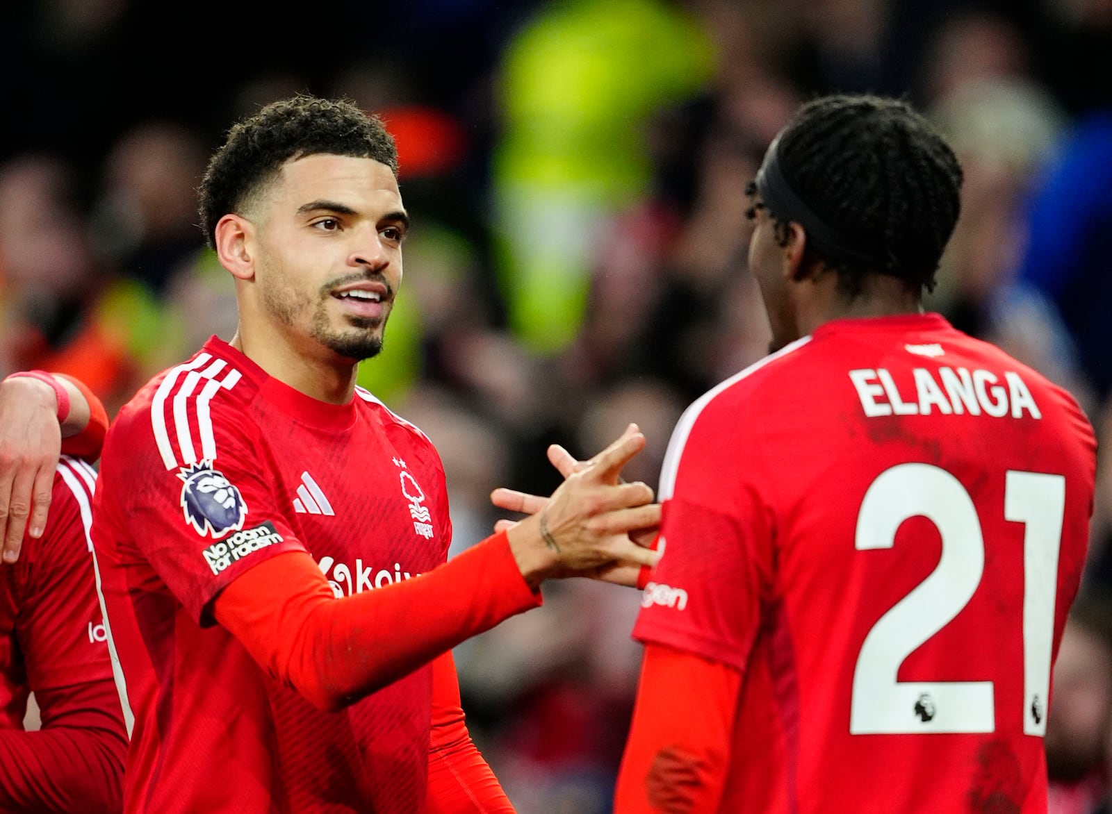 Nottingham Forest's Morgan Gibbs-White, left, celebrates scoring their side's second goal during the English Premier League soccer match between Everton and Nottingham Forest at Goodison Park, Liverpool, England, Sunday, Dec. 29, 2024. (Peter Byrne/PA via AP)