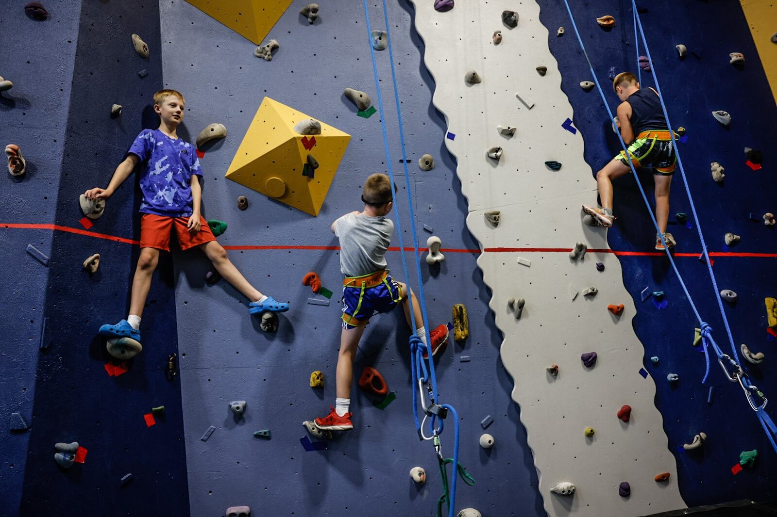 Washington Twp. summer camp members, climb the wall at the RecPlex on Wednesday, July 5, 2023. The fitness center at the RecPlex has been upgraded including a refaced climbing wall. JIM NOELKER/STAFF