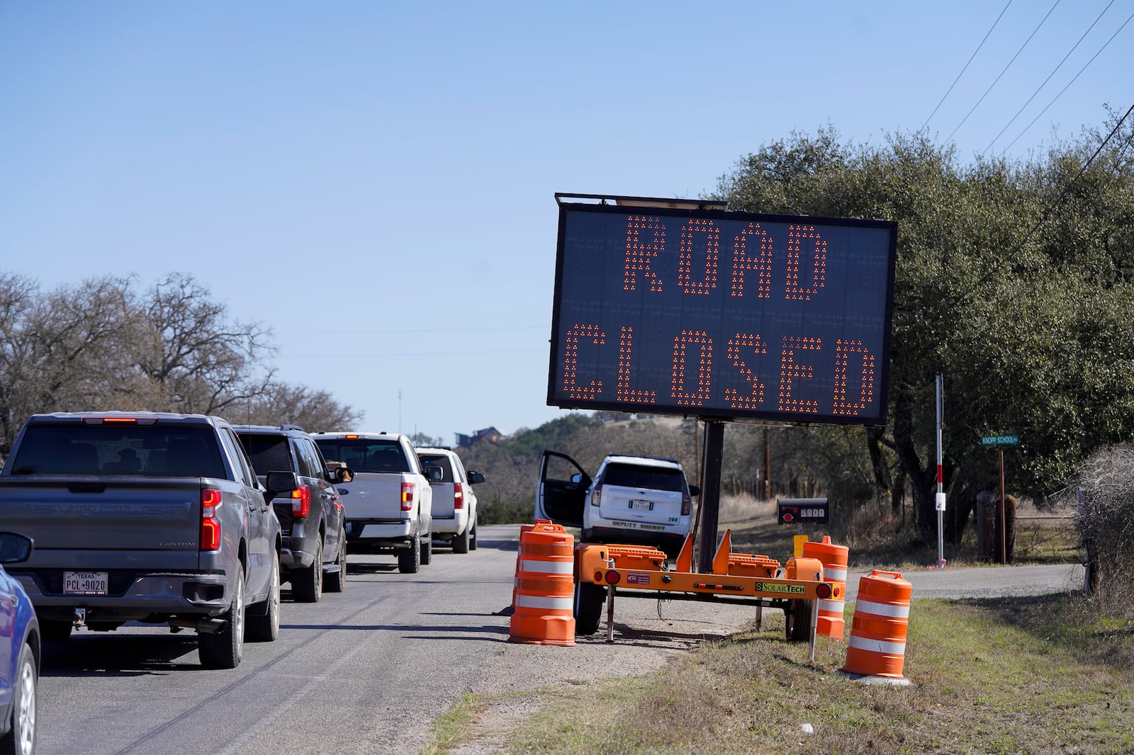 Gillespie County's Hwy 16 is closed due to the Crabapple Fire north of Fredericksburg, Texas, Sunday, March 16, 2025. (Robin Jerstad/The San Antonio Express-News via AP)