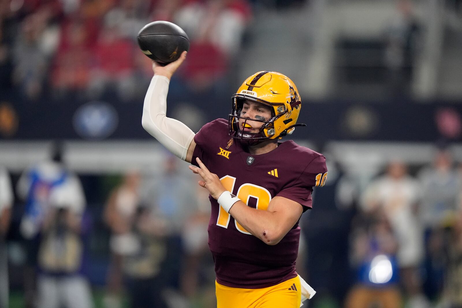 FILE - Arizona State quarterback Sam Leavitt (10) throws a pass in the first half of the Big 12 Conference championship NCAA college football game against Iowa State, in Arlington, Texas, Saturday Dec. 7, 2024. (AP Photo/LM Otero, File)