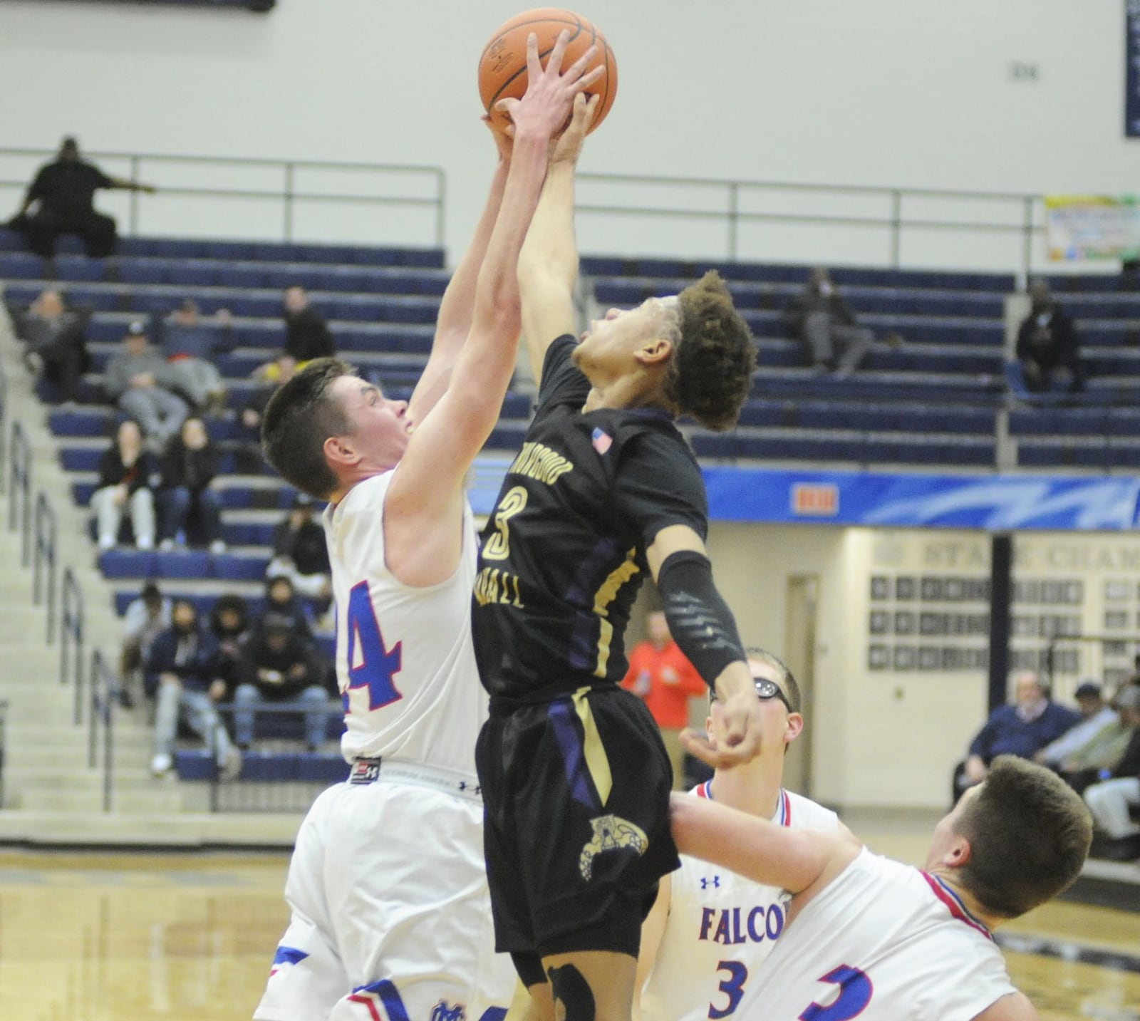 Eric Middlebrook of Thurgood Marshall (3) battles Griffin Laake of Clinton-Massie for a rebound. Thurgood defeated Massie 68-51 in a D-II boys high school basketball sectional semifinal at Trent Arena on Tuesday, Feb. 26, 2019. MARC PENDLETON / STAFF