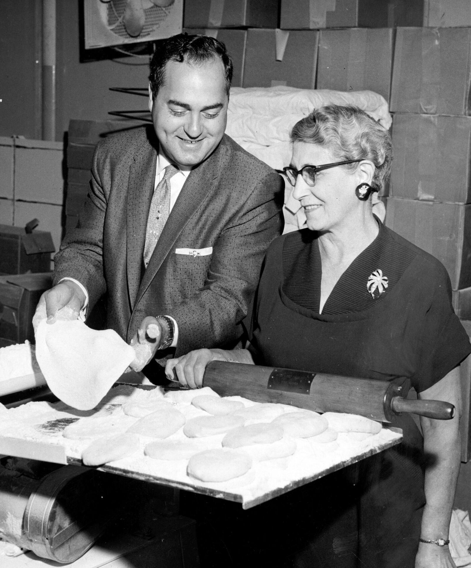 The original caption dated July 7, 1964 reads: “Marking their 11th anniversary this month are the Vic Cassano-Mom Donisi Pizza houses which have grown from a one-store operation to a $3 million a year business. Above, Cassano and Mrs. John (Mom) Donisi, his mother-in-law, are shown in the central commissary from which ingredients are distributed to their pizza outlets.” DAYTON DAILY NEWS ARCHIVE