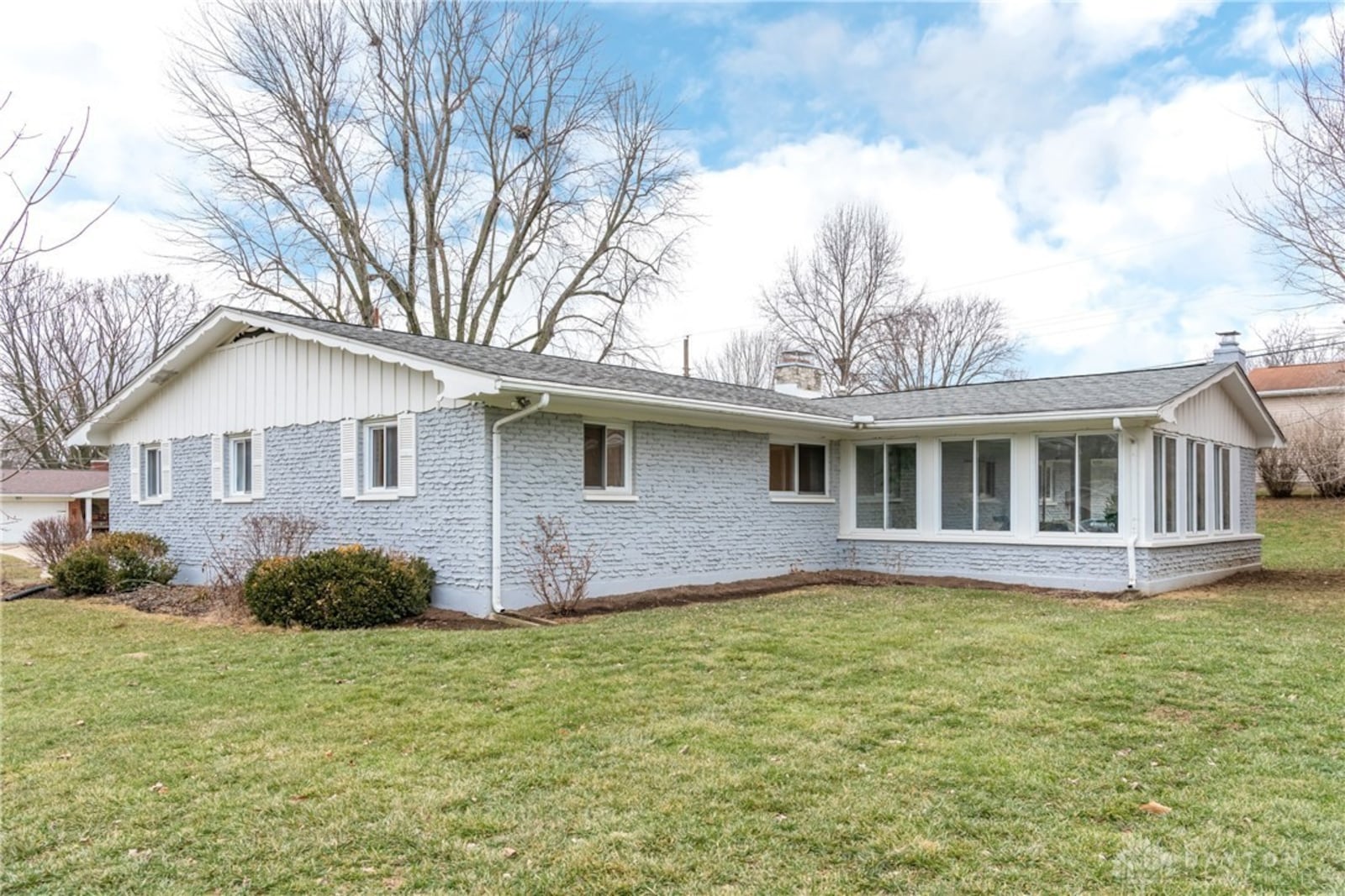 The home has a three seasons room at the rear and a total of three woodburning fireplaces.