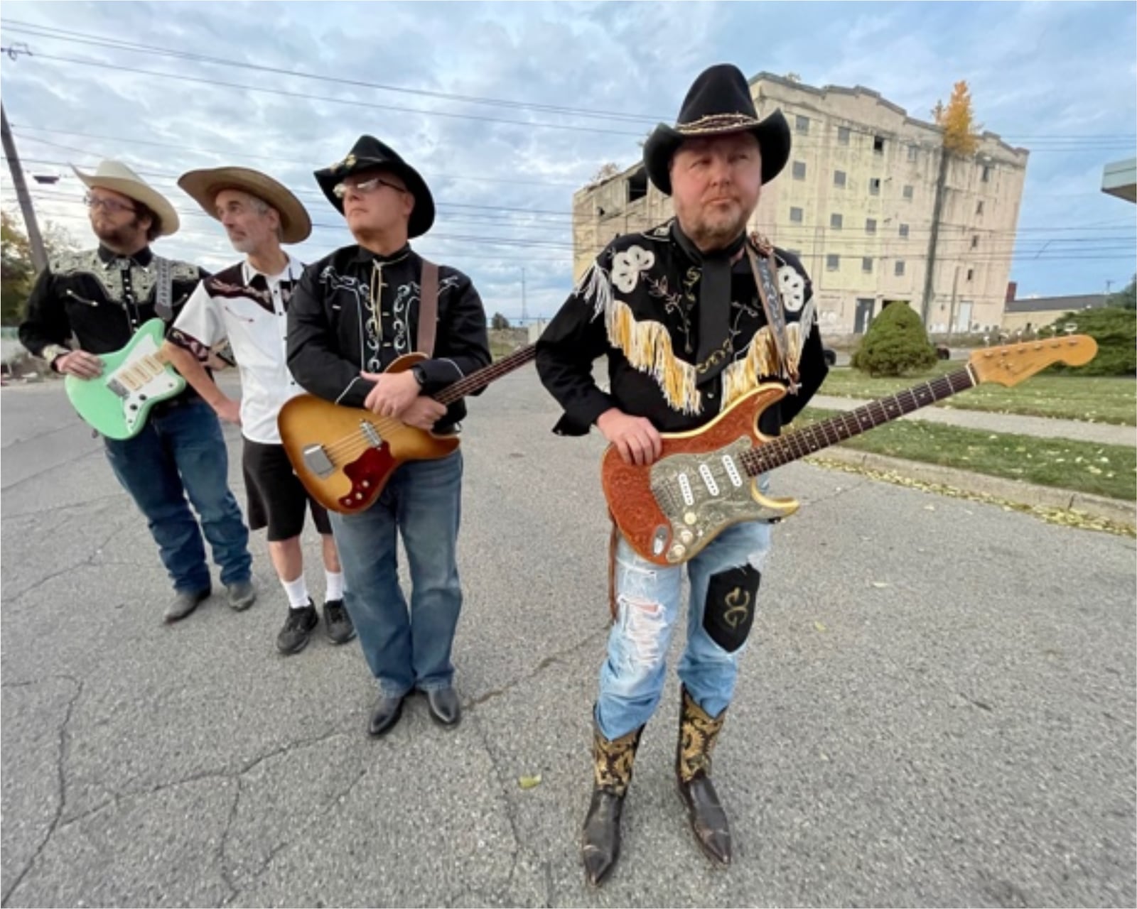 Local honky-tonk country act Golden Guy and His Bucking Bloviators, (left to right) Plectrum, Lanky Luke, Col. Poppin and Golden Guy, celebrate the new Atom Records release, “Personal Pain,” at Hidden Gem Music Club in Centerville on Friday, Oct. 20.