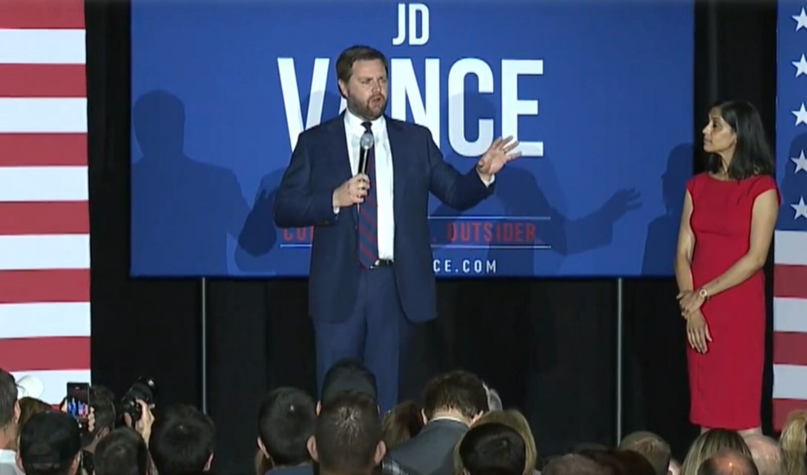 JD Vance speaks on stage with his wife, Usha Vance, after winning the Ohio GOP primary for U.S. Senate. WCPO