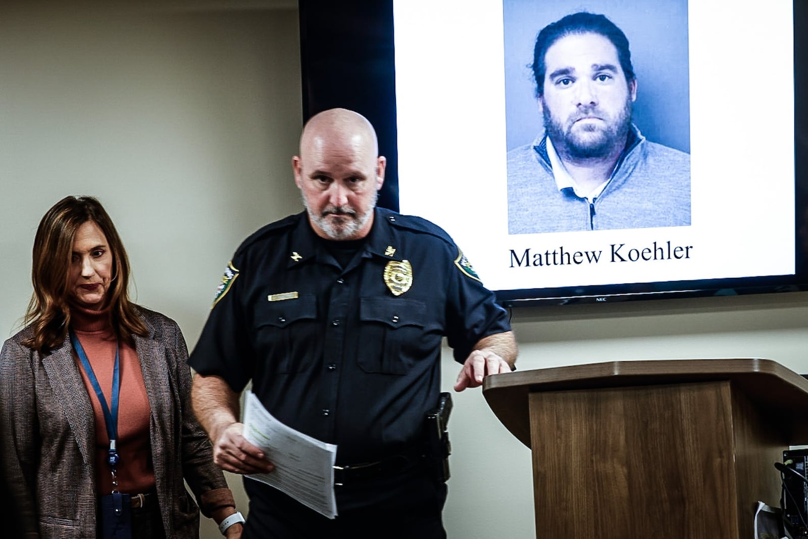 Kettering Schools superintendent Mindy McCarty-Stewart and Kettering police chief Chip Protsman walk out of a press conference Wednesday, Dec. 6, 2023, after announcing the arrest of a Kettering teacher on pandering obscenity, pandering sexually oriented material involving a minor and illegal use of a minor in nudity-oriented material. JIM NOELKER/STAFF