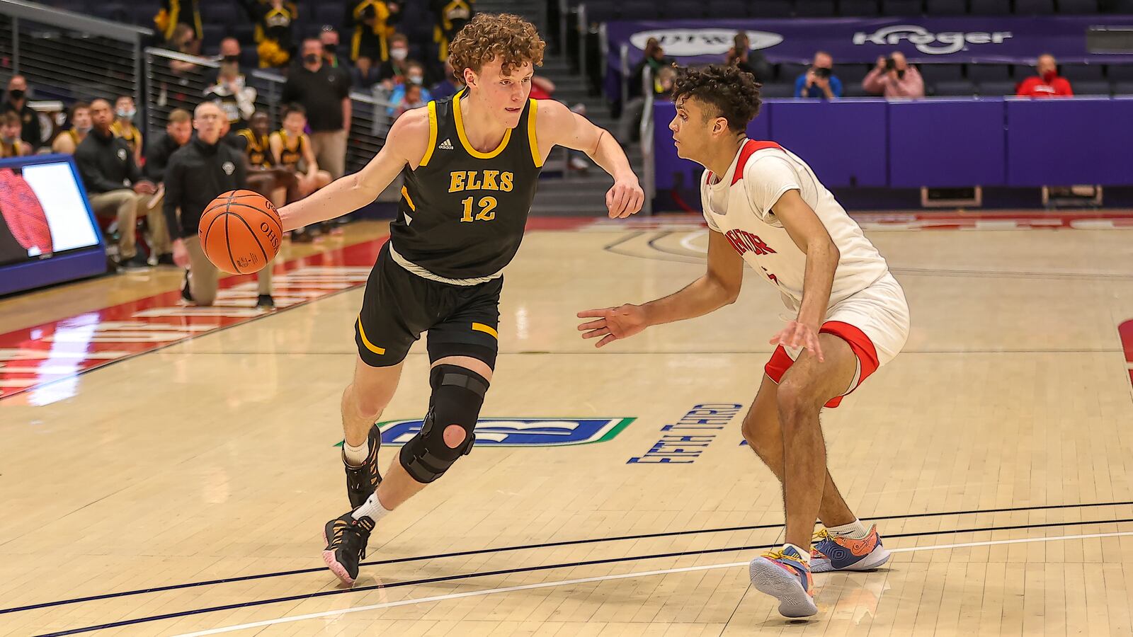 Centerville High School junior Tom House drives past Mentor's Jonah Waag during their game on Saturday night at UD Arena. Michael Cooper/CONTRIBUTED