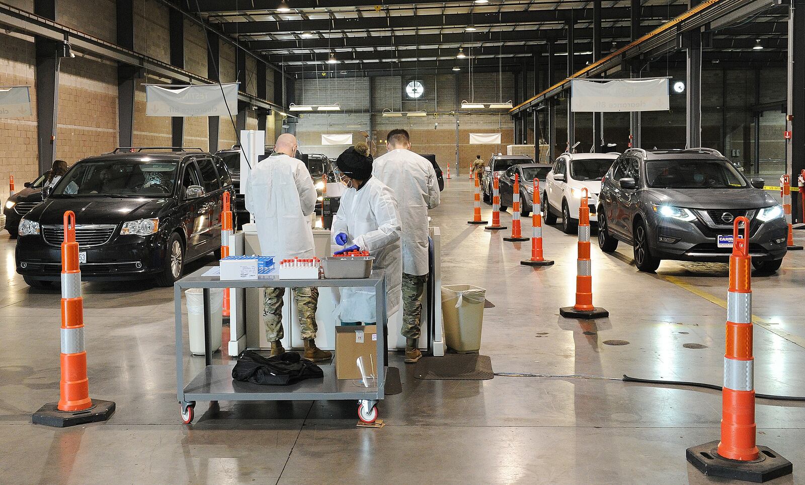 Vehicles line up at the Dayton Children's Springboro COVID-19 testing site Thursday Jan. 13, 2022. The Ohio National Guard is assisting with the testing allowing the site to triple its capacity. The facility, is located at 3300 W. Tech Road. MARSHALL GORBY\STAFF