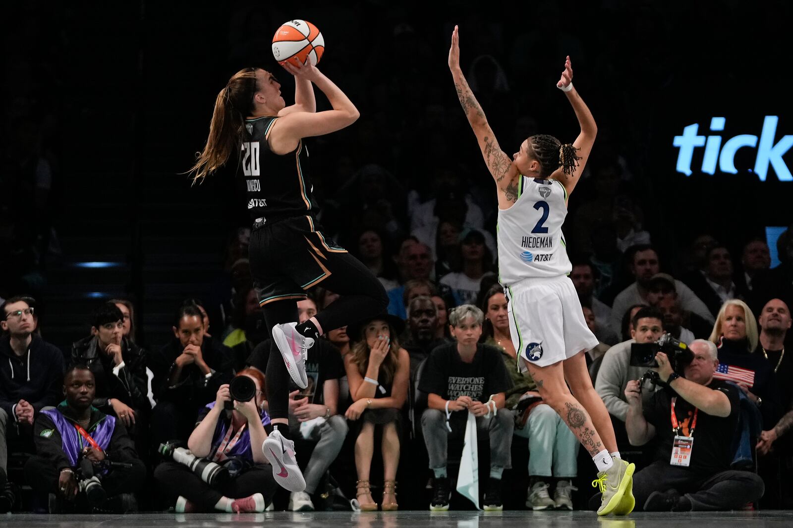 New York Liberty guard Sabrina Ionescu (20) puts up a shot against Minnesota Lynx guard Natisha Hiedeman (2) during the fourth quarter of Game 5 of the WNBA basketball final series, Sunday, Oct. 20, 2024, in New York. (AP Photo/Pamela Smith)