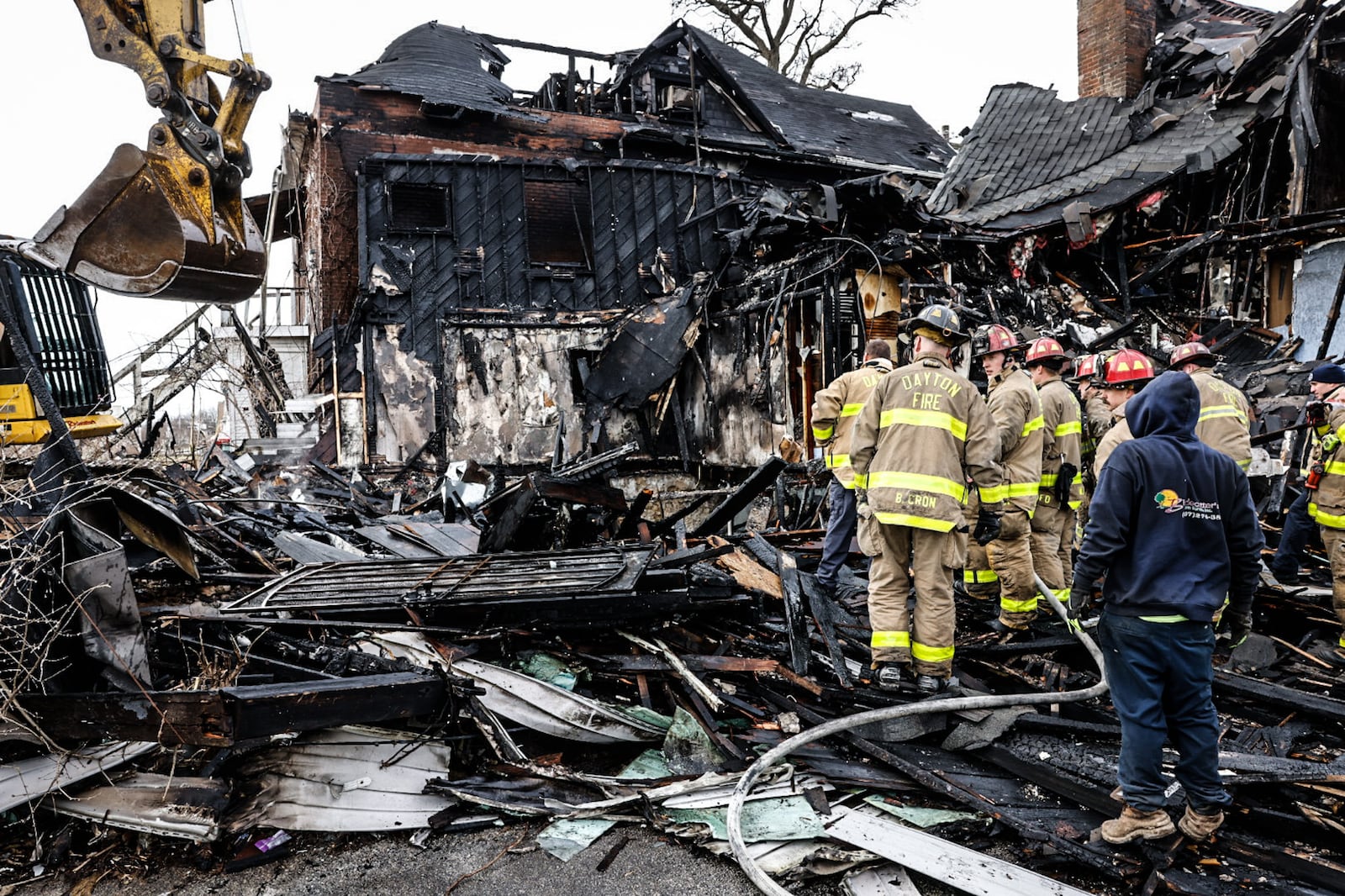 The bodies of five people were discovered in heavy debris in the aftermath of a large fire Wednesday morning, March 8, 2023, at a vacant house in the 500 block of North Broadway Street in Dayton. Crews ordered emergency demolition of two houses destroyed in the fire. A third house was damaged in the massive blaze. JIM NOELKER/STAFF