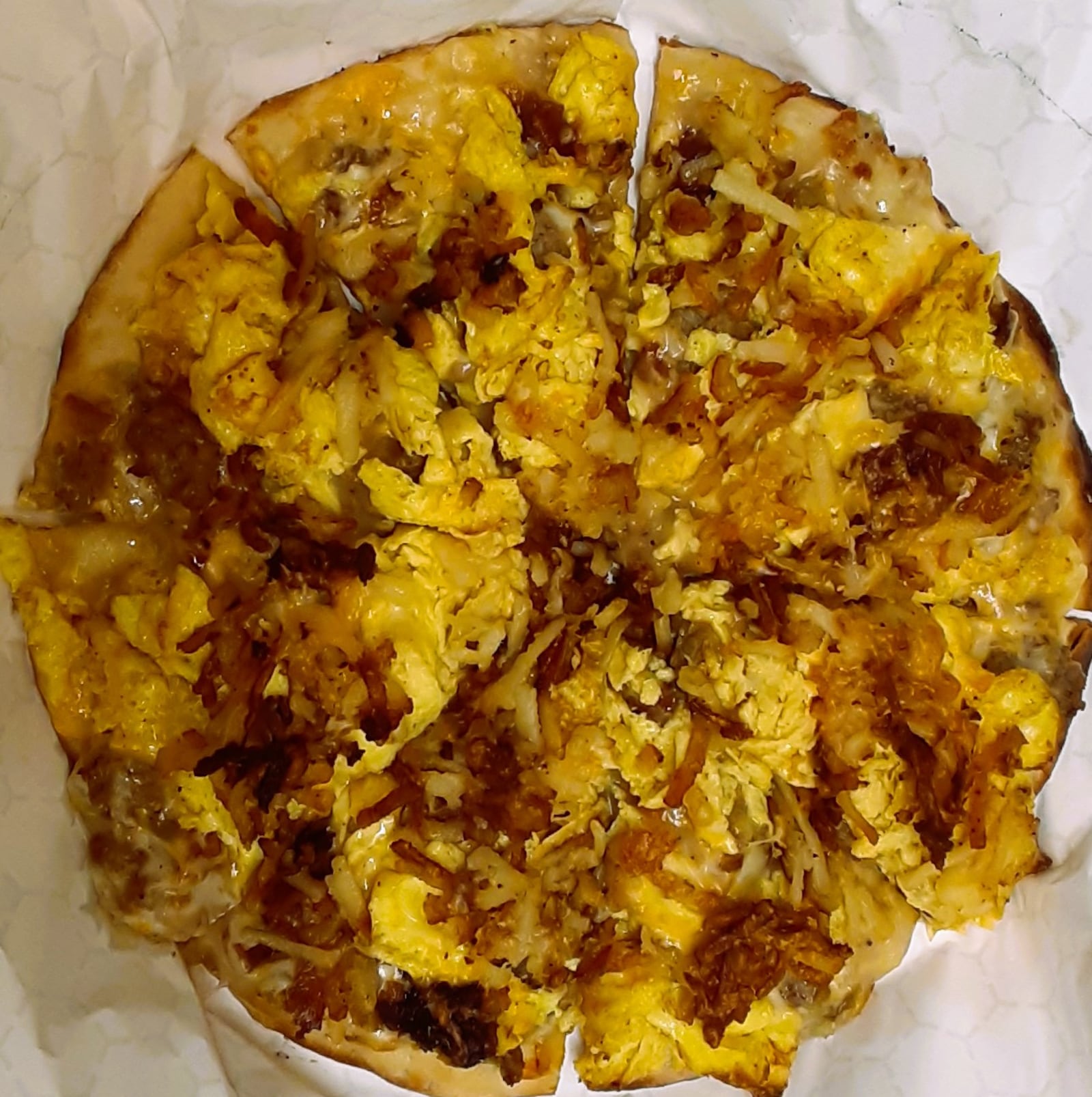 Breakfast Pizza - CBCB Bar and Grill: Get ready to enjoy some breakfast pizza — sausage gravy, hash browns, eggs, bacon and cheese on a homemade pizza crust. They serve breakfast every Saturday and Sunday from 9 a.m.-1 p.m.