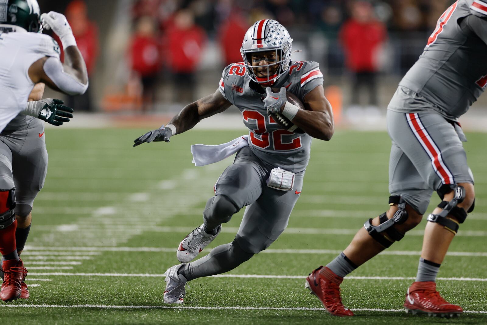 FILE - Ohio State running back TreVeyon Henderson plays against Michigan State during an NCAA college football game Saturday, Nov. 11, 2023, in Columbus, Ohio. TreVeyon Henderson said Wednesday, Dec. 27, 2023 that he would play when Buckeyes (11-1) play Missouri (10-2) in the Cotton Bowl.(AP Photo/Jay LaPrete, File)