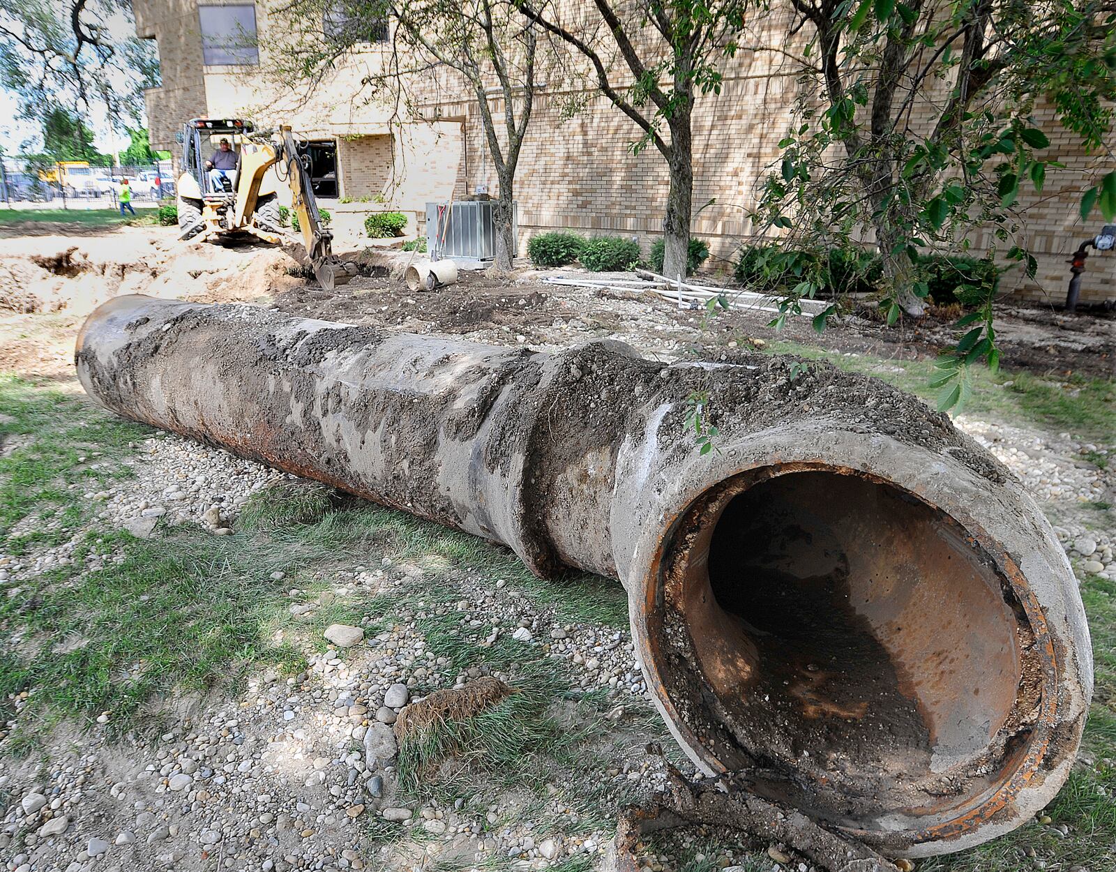 Work continues on the water main break along Keowee Street Wednesday. The broken pipe was removed. MARSHALL GORBY\STAFF