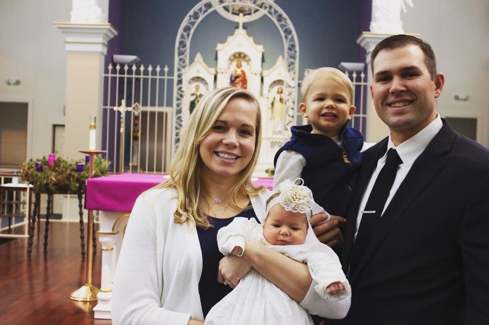 Audrey Stammen holds their daughter Summit at her baptism ceremony at St. Louis Catholic Church in North Star. Her husband Craig holds their son Chase. CONTRIBUTED