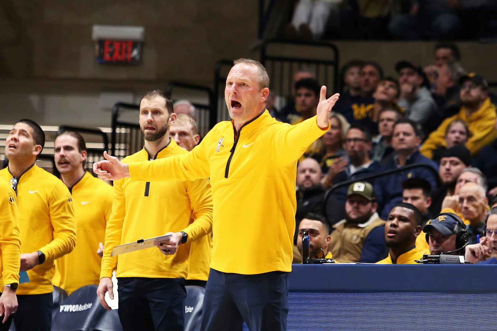 West Virginia coach Darian Devries reacts during the first half of an NCAA college basketball game against Arizona, Tuesday, Jan. 7, 2025, in Morgantown, W.Va. (AP Photo/Kathleen Batten)