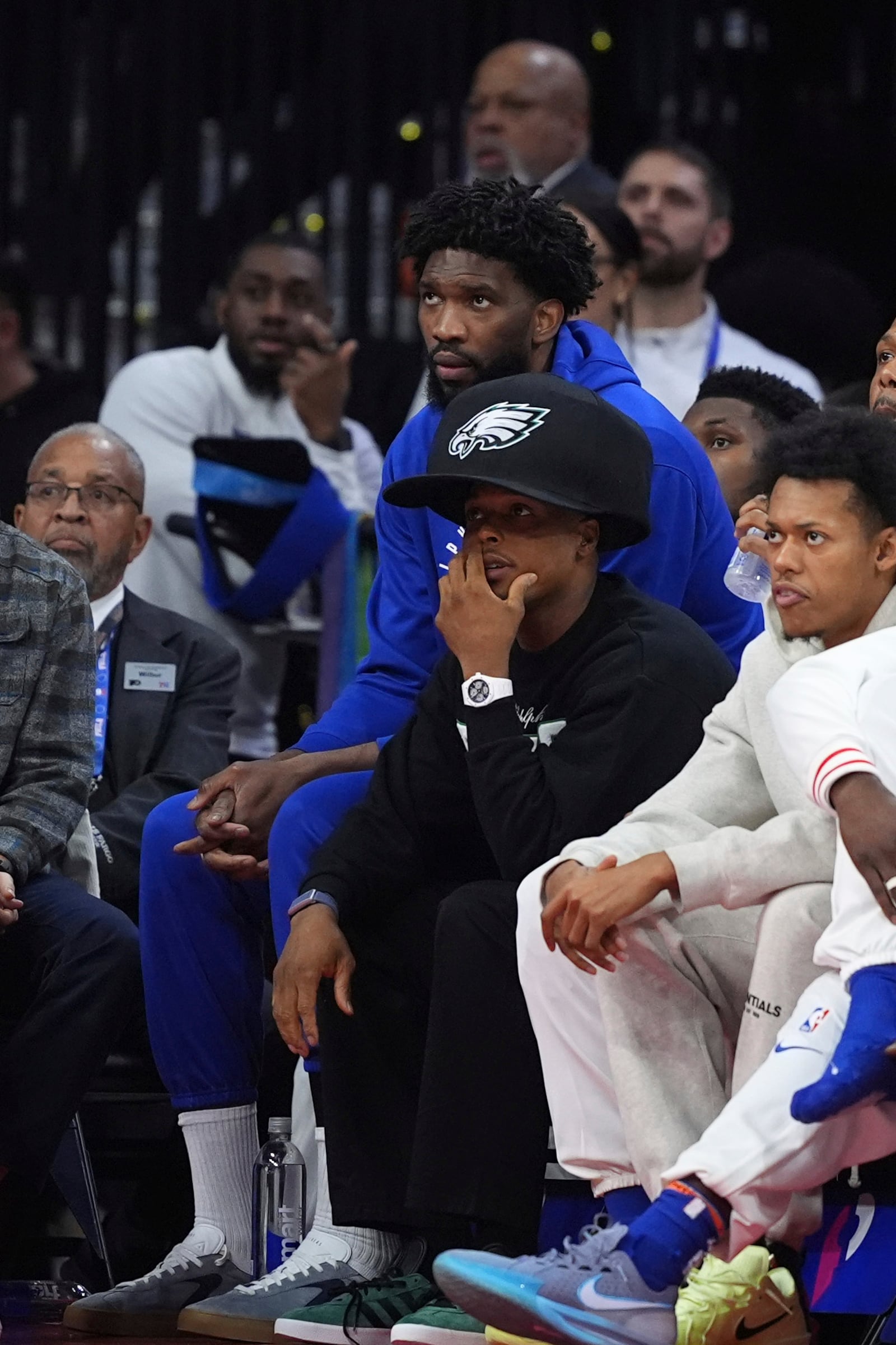 Philadelphia 76ers' Joel Embiid, left, and Kyle Lowry watch from bench during the first half of an NBA basketball game against the Los Angeles Clippers, Sunday, Nov. 24, 2024, in Philadelphia. (AP Photo/Matt Slocum)