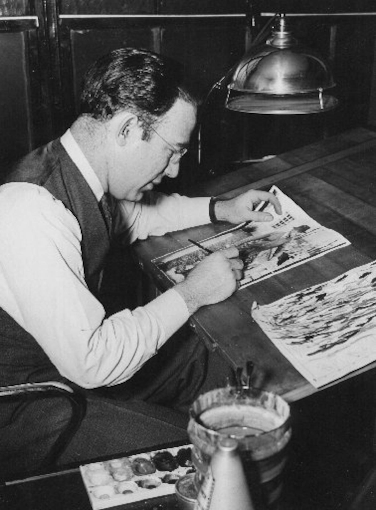 Myron Scott, shown working on artwork for the Dayton Daily News in the 1940s.  Scott was also a photographer at the newspaper, invented the Soap Box Derby and was the man who named the Corvette automobile.