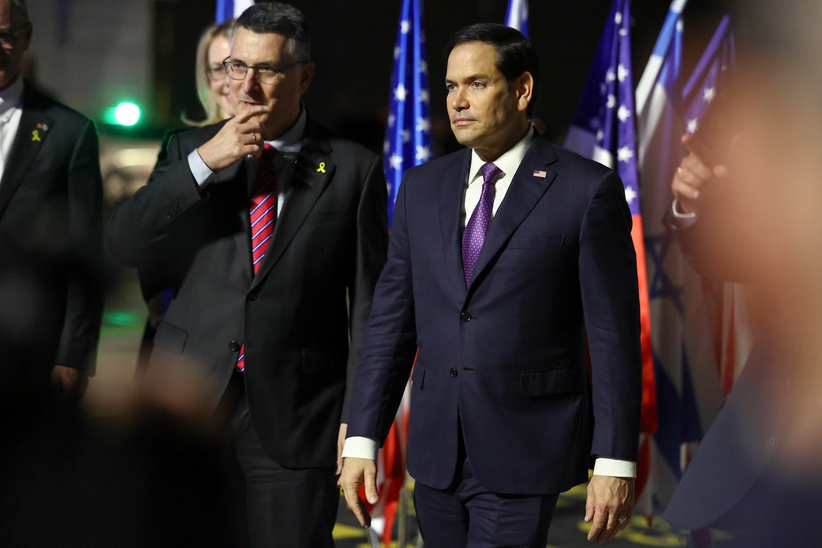 Israel's Foreign Minister Gideon Sa'ar welcomes U.S. Secretary of State Marco Rubio as he arrives in Israel, on the first leg of his Middle East trip, in Tel Aviv, Israel, on Satruday, Feb. 15, 2025. (Evelyn Hockstein/Pool Photo via AP)