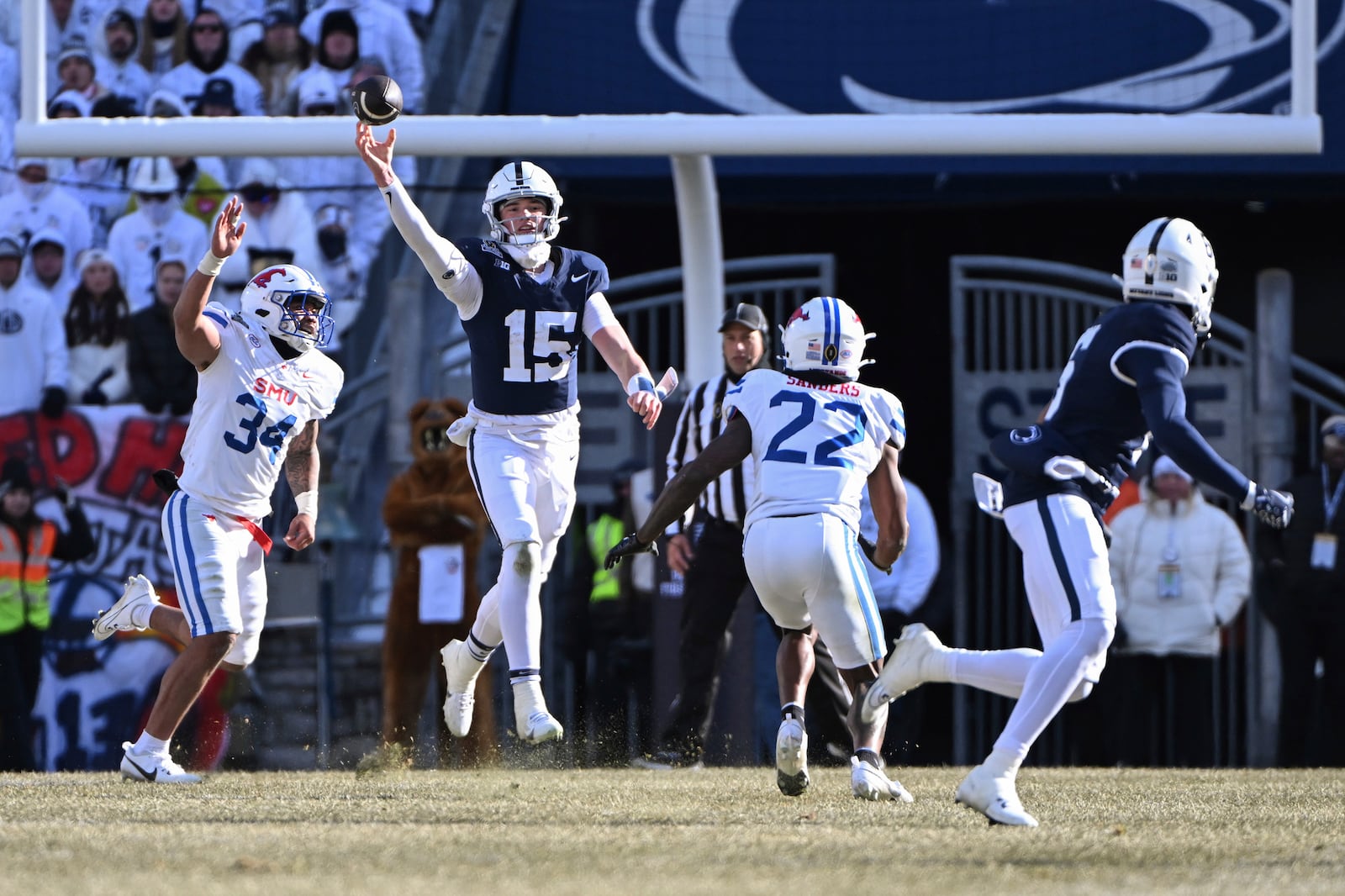 Penn State quarterback Drew Allar throws a pass to wide receiver Harrison Wallace III as SMU safety Cale Sanders Jr. (22) defends during the first half in the first round of the NCAA College Football Playoff, Saturday, Dec. 21, 2024, in State College, Pa. (AP Photo/Barry Reeger)