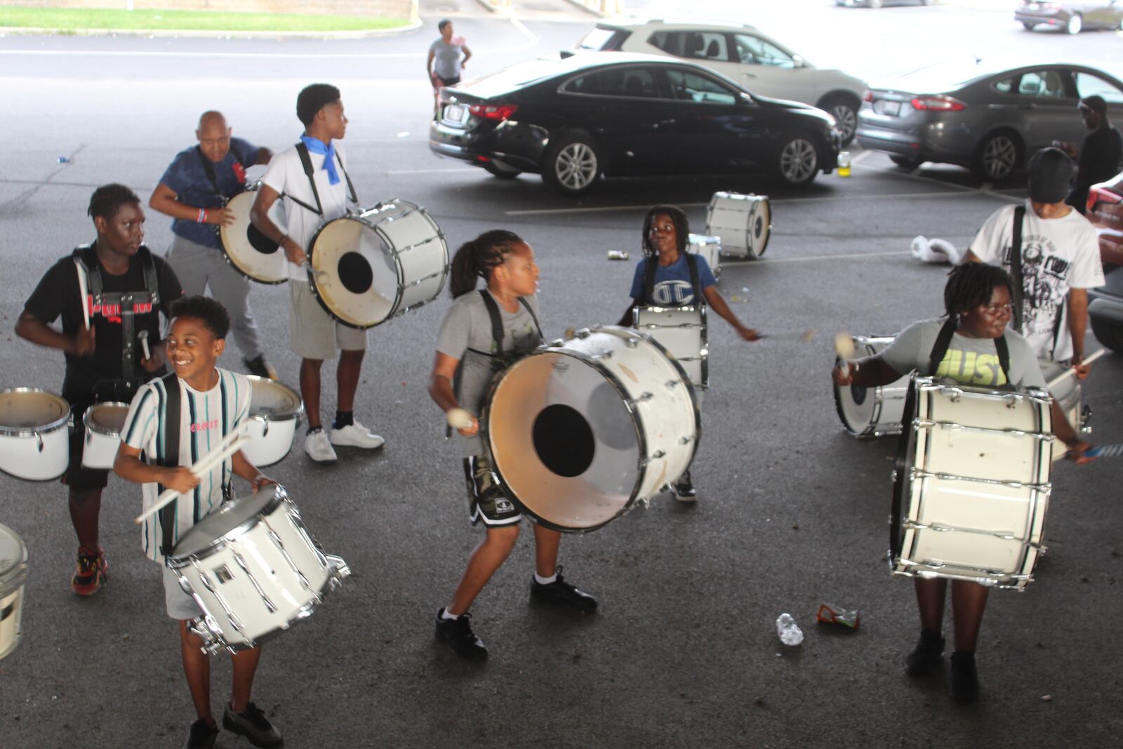 Members of the Western Stars Drill Team & Drum Line practice in a parking lot in downtown Dayton. CORNELIUS FROLIK / STAFF