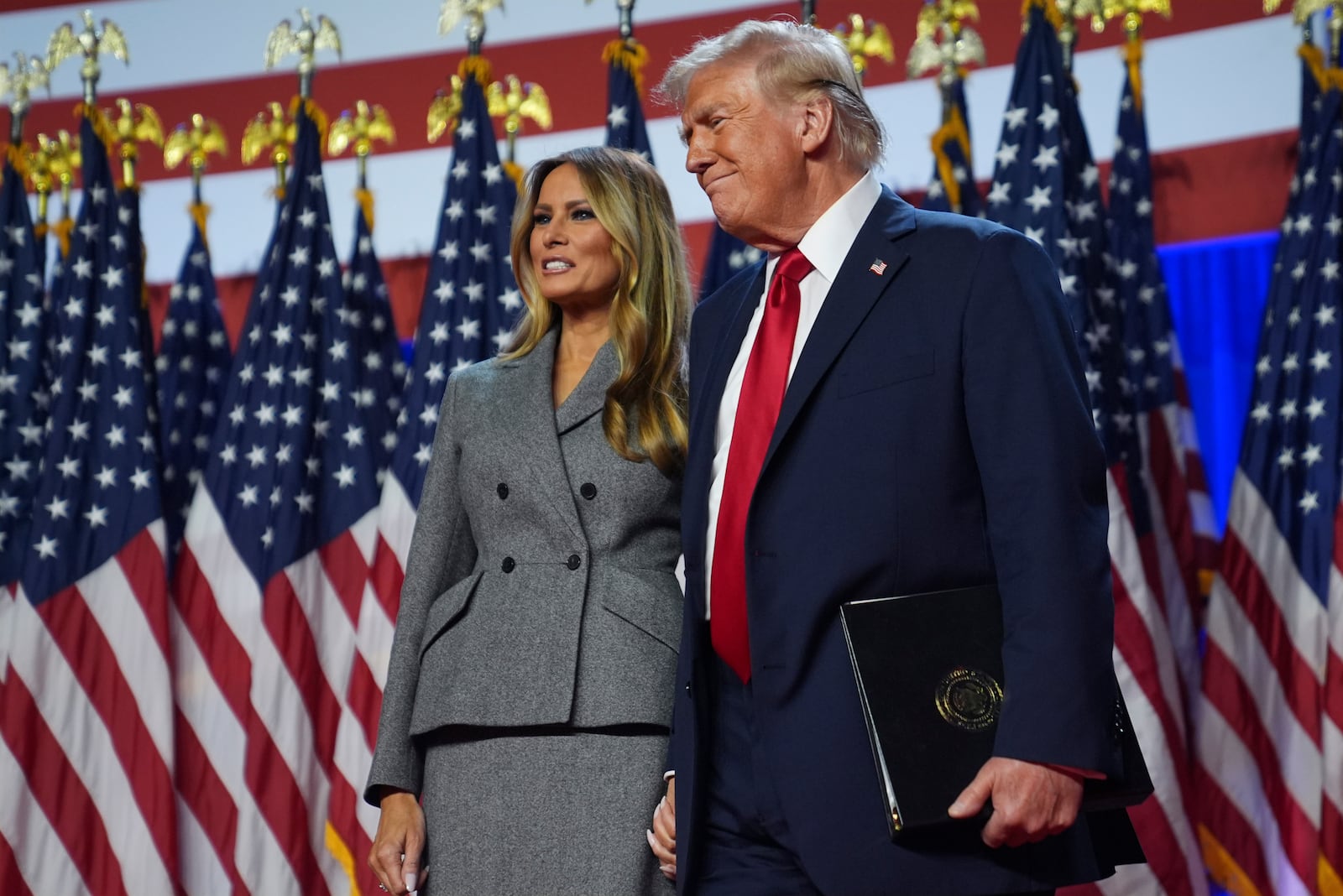 Republican presidential nominee former President Donald Trump stands with former first lady Melania Trump at an election night watch party at the Palm Beach Convention Center, Wednesday, Nov. 6, 2024, in West Palm Beach, Fla. (AP Photo/Evan Vucci)