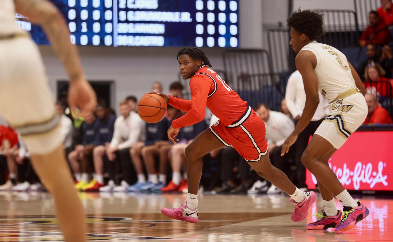 Dayton's Malachi Smith dribbles against George Washington on Saturday, Jan. 4, 2025, at the Charles E. Smith Center in Washington, D.C. David Jablonski/Staff