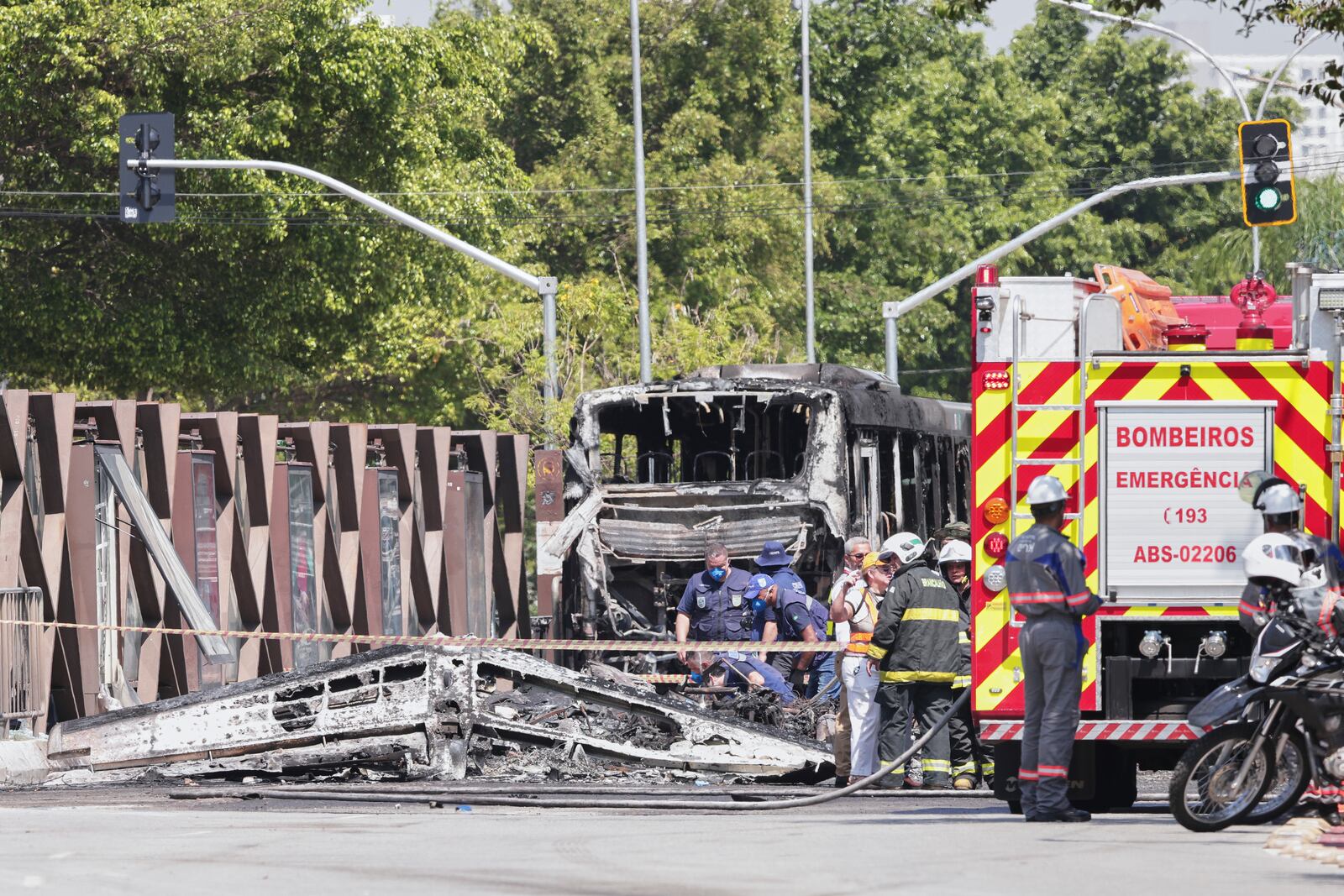 Firefighters inspect a small aircraft that crashed on an avenue in Sao Paulo, Friday, Feb. 7, 2025. (AP Photo/Ettore Chiereguini)