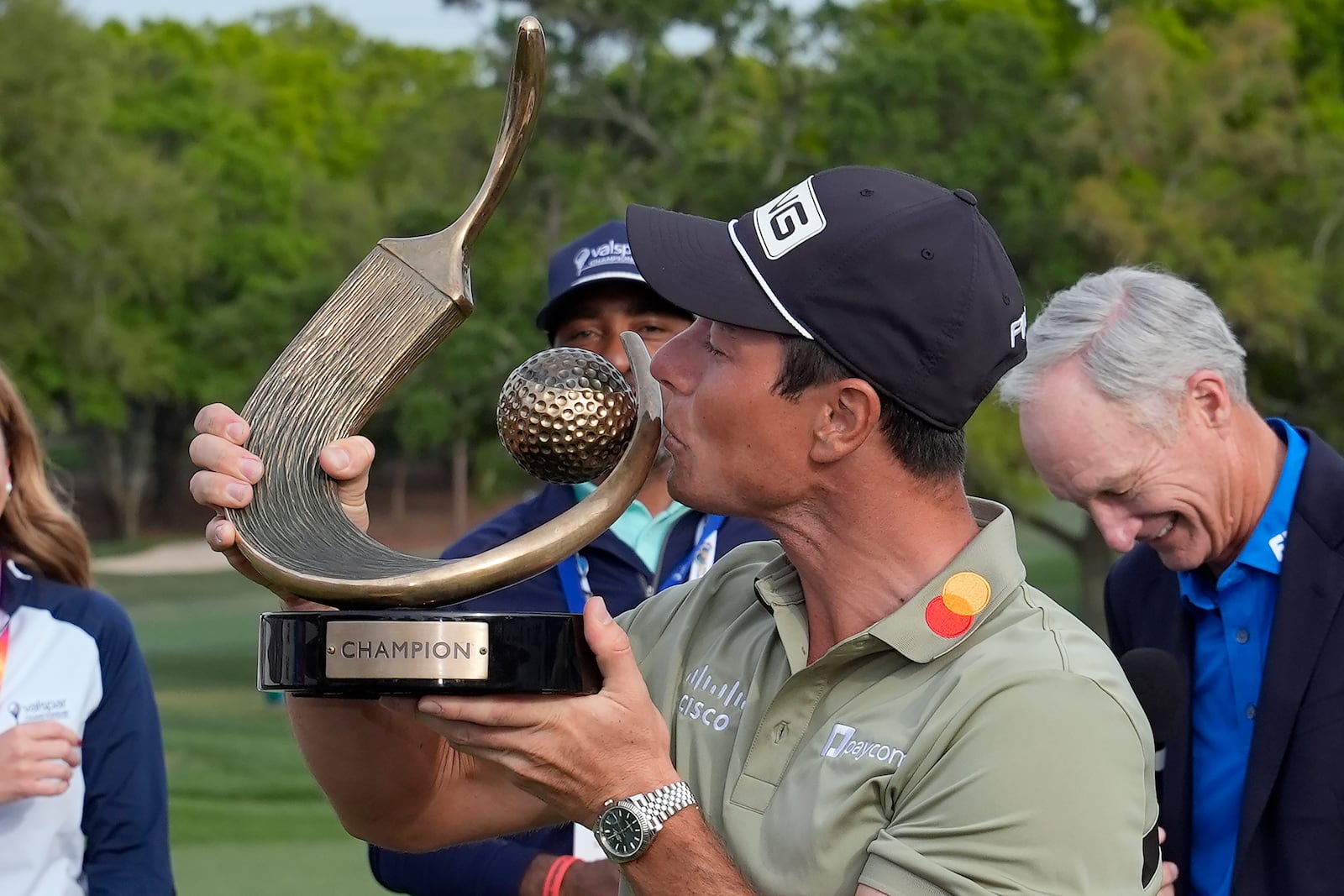 Viktor Hovland, of Norway, kisses the trophy after winning the Valspar Championship golf tournament Sunday, March 23, 2025, at Innisbrook in Palm Harbor, Fla. (AP Photo/Chris O'Meara)