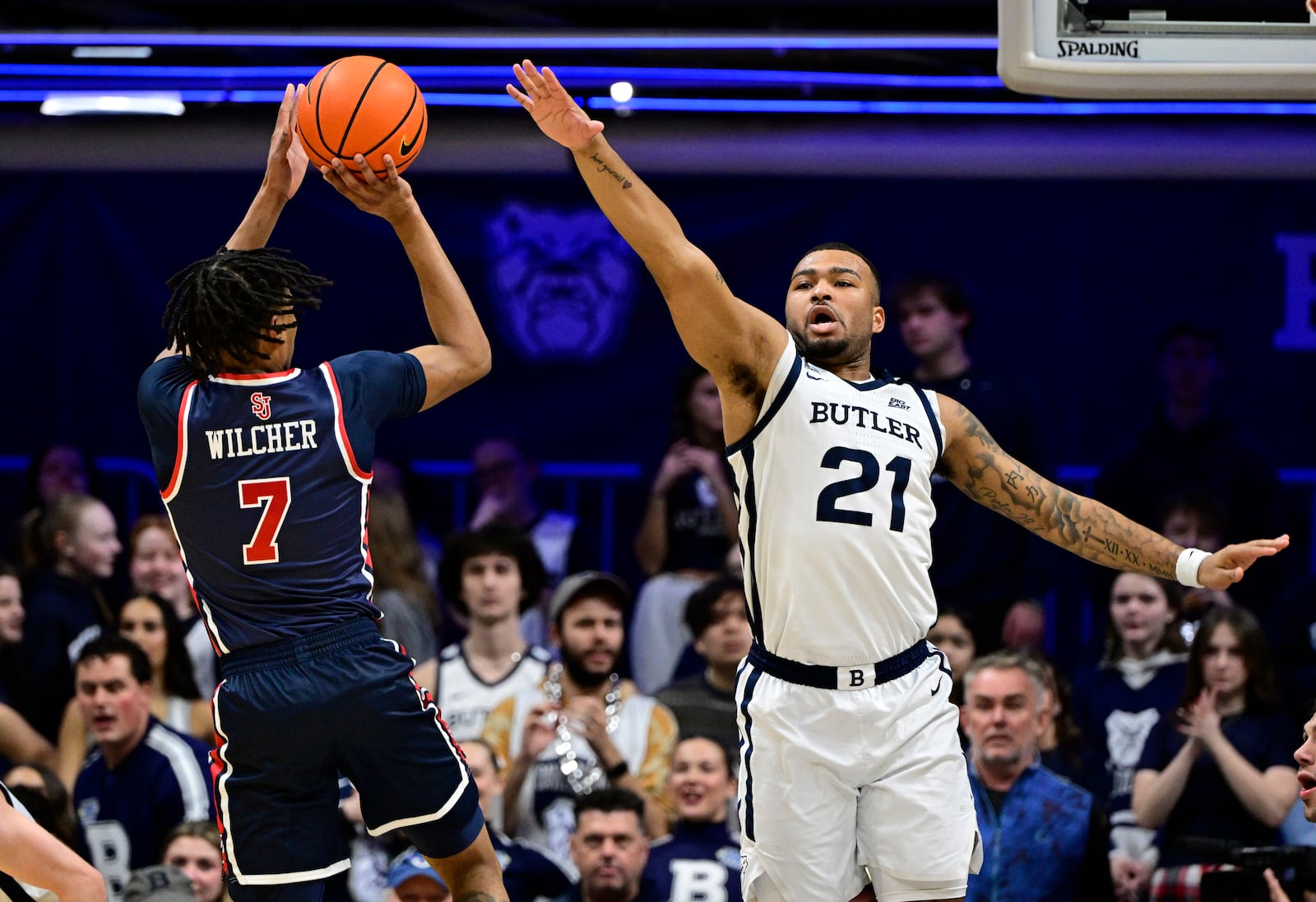 St. John's guard Simeon Wilcher (7) shoots the ball over Butler ath Dante Maddox Jr. (21) during the first half of an NCAA college basketball game, Wednesday, Feb. 26, 2025, in Indianapolis, Ind. (AP Photo/Marc Lebryk)