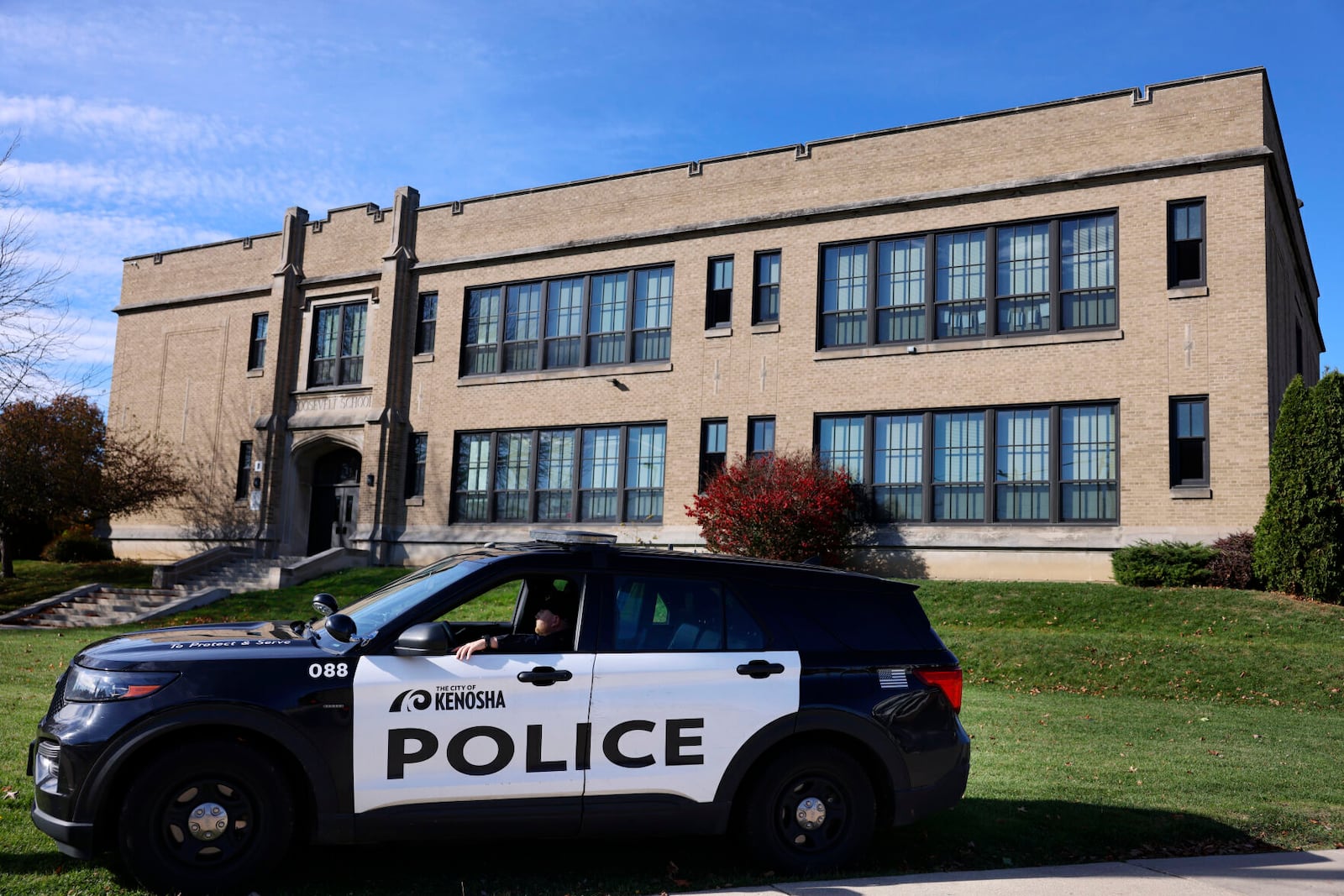 The Kenosha Police Department is parked in front of Roosevelt Elementary School on Thursday, Nov. 7, 2024 in Kenosha, Wis. (Sean Krajacic/The Kenosha News via AP)