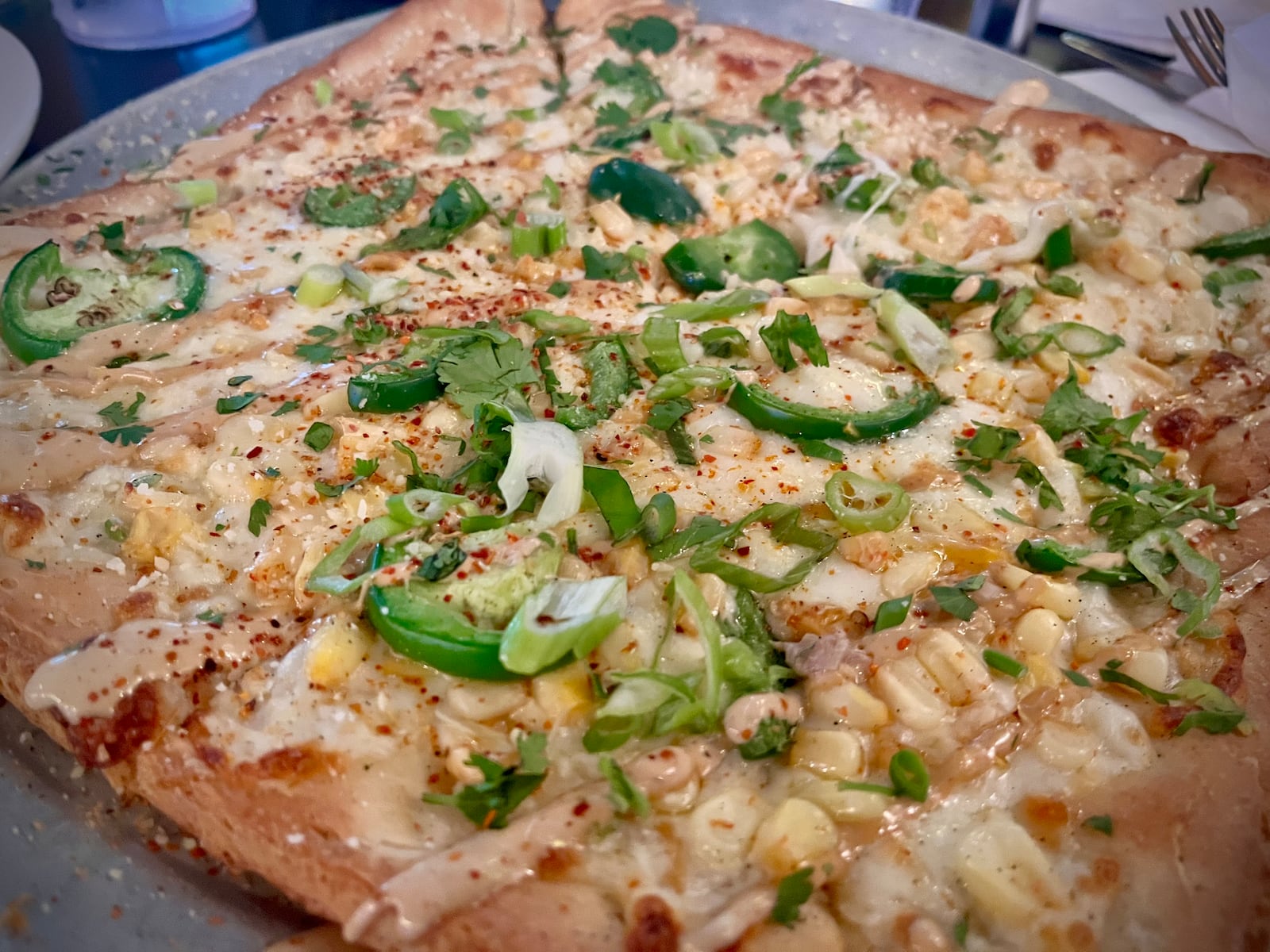 Street Corn pizza on gluten-free crust from Pies & Pints at The Greene in Beavercreek. NATALIE JONES/STAFF