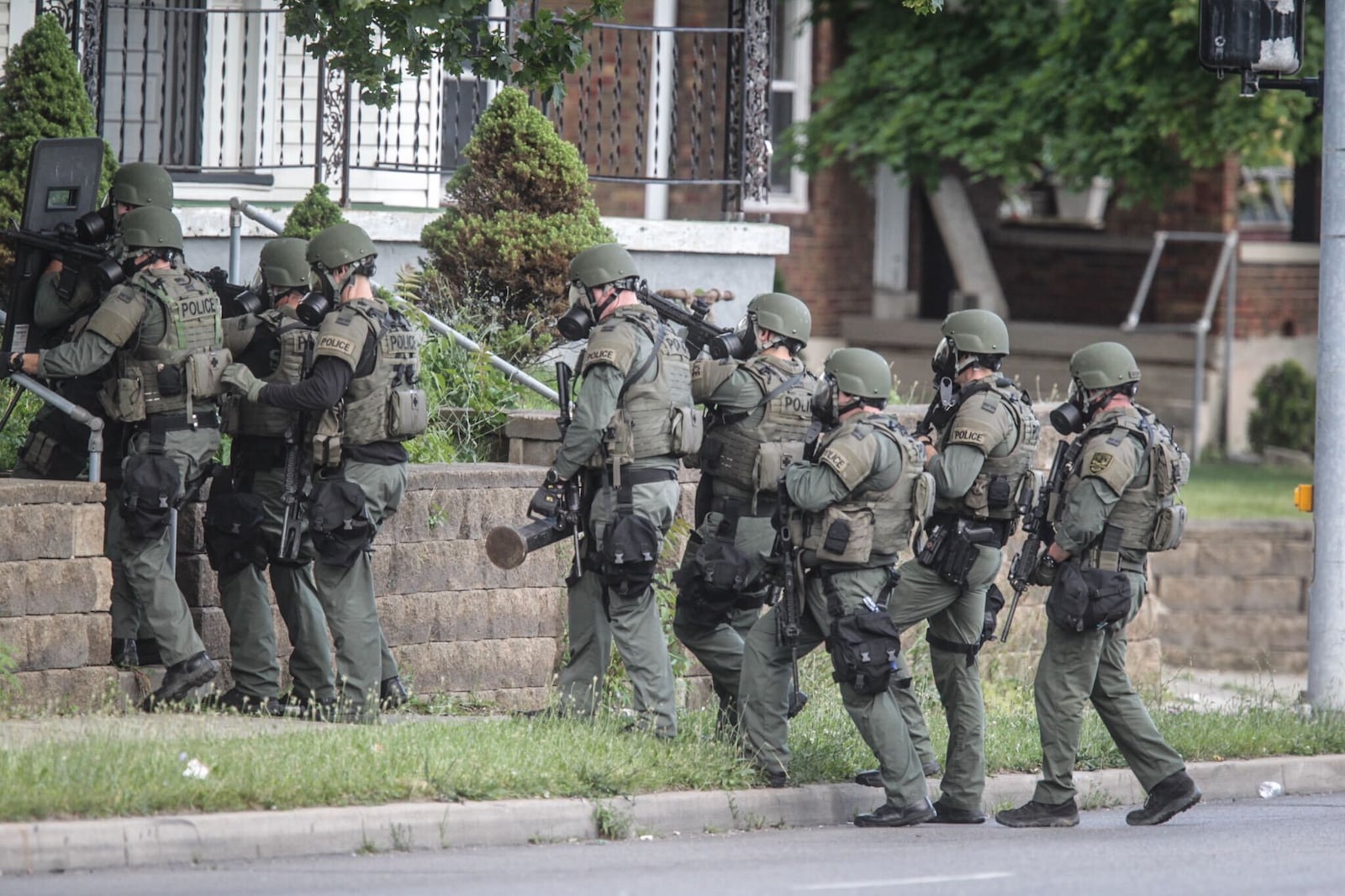 Dayton police and a SWAT team responded Thursday afternoon to a North Main Street house for a man wanted for abduction and domestic violence. JIM NOELKER/STAFF