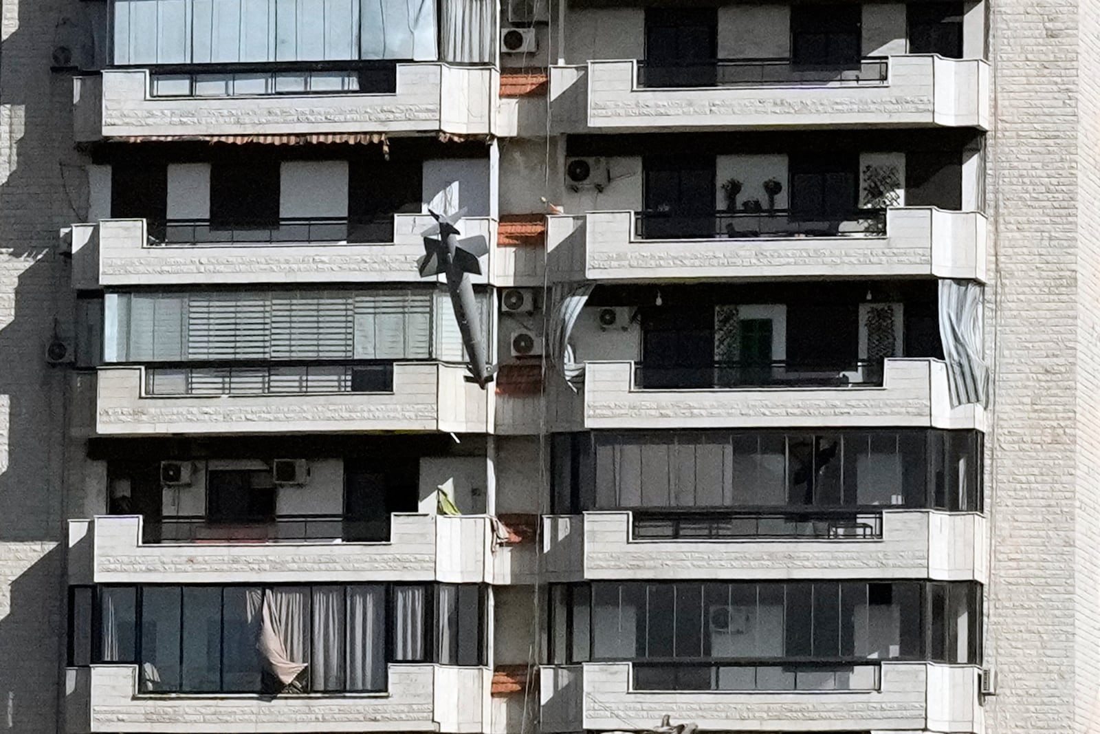 A missile launched from an Israeli jet hits a building in Ghobeiri, Beirut, Lebanon, Tuesday, Oct. 22, 2024. (AP Photo/Bilal Hussein)