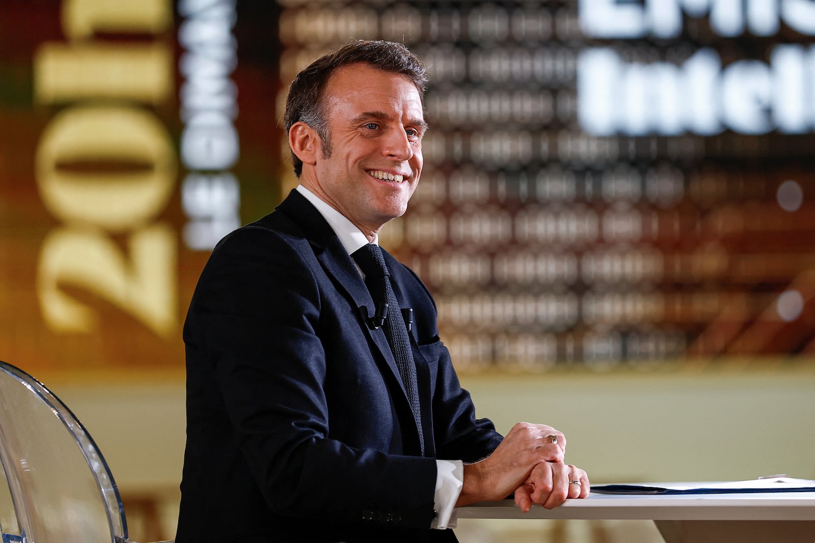 French President Emmanuel Macron attends an interview on national television, ahead of the Artificial Intelligence Action Summit at the Grand Palais in Paris, Sunday, Feb. 9, 2025. (Gonzalo Fuentes, Pool Photo via AP)