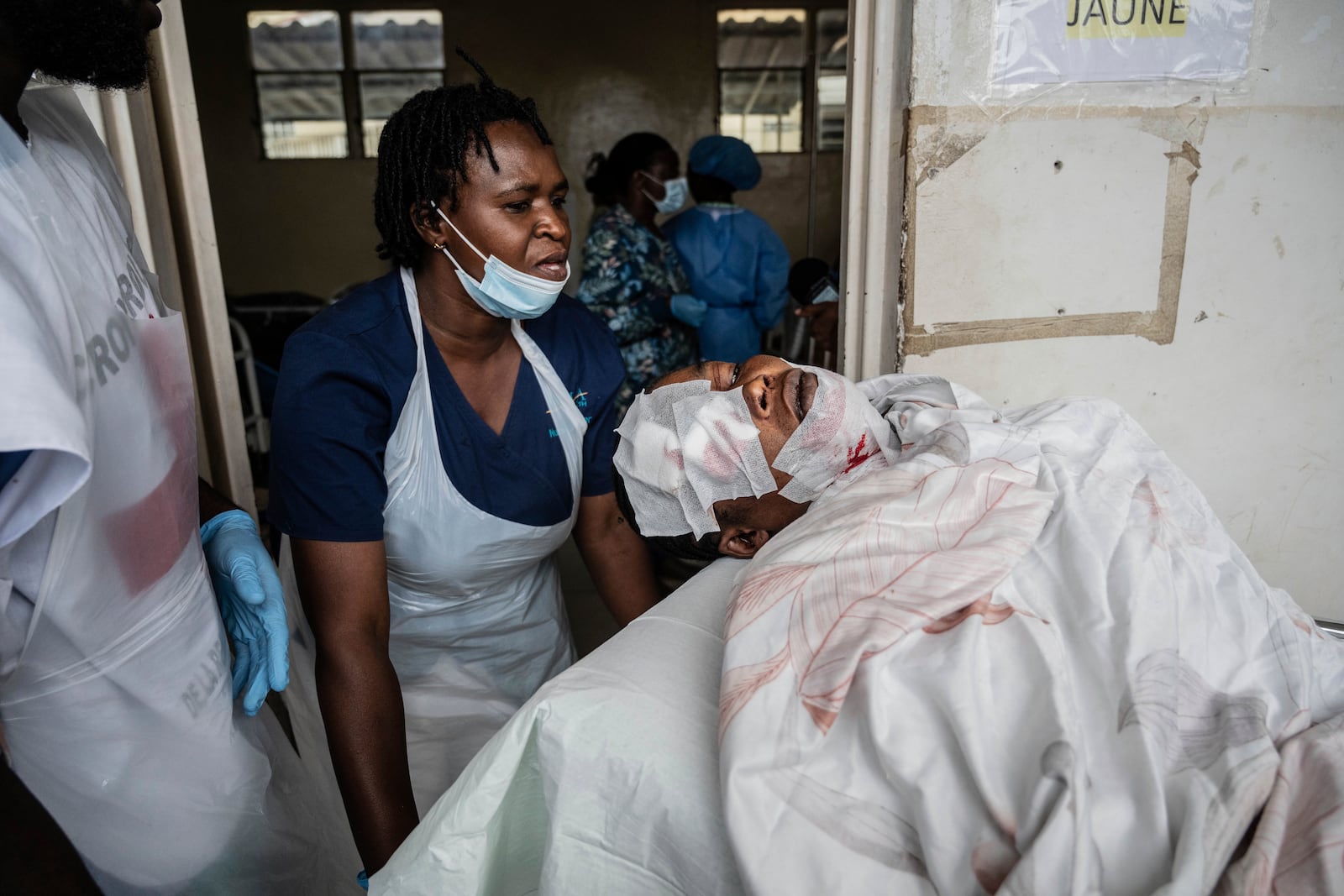 People wounded in the fighting between M23 rebels and Congolese armed forces arrive at the Cbeca Ndosho hospital in Goma, Democratic Republic of the Congo, Thursday, Jan. 23, 2025. (AP Photo/Moses Sawasawa)